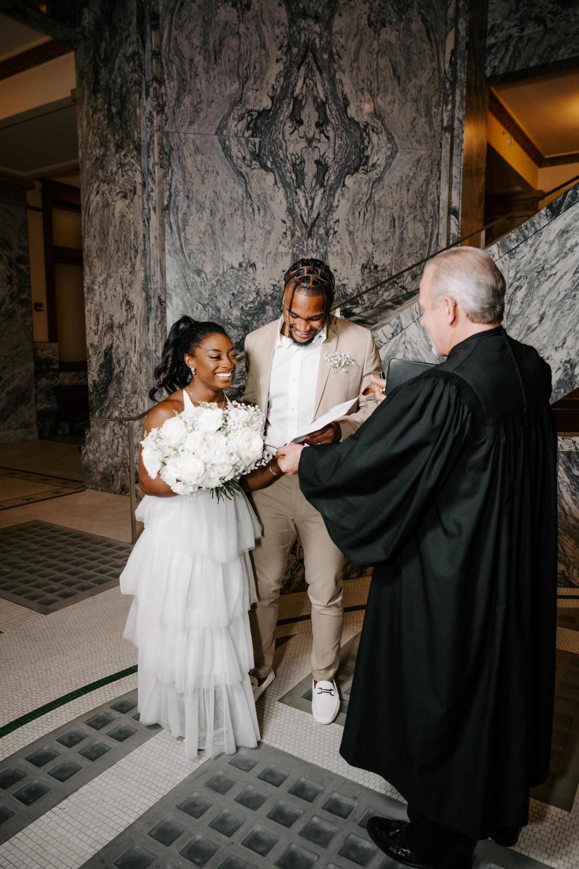 Simone Biles and Jo<i></i>nathon Owens in a courthouse