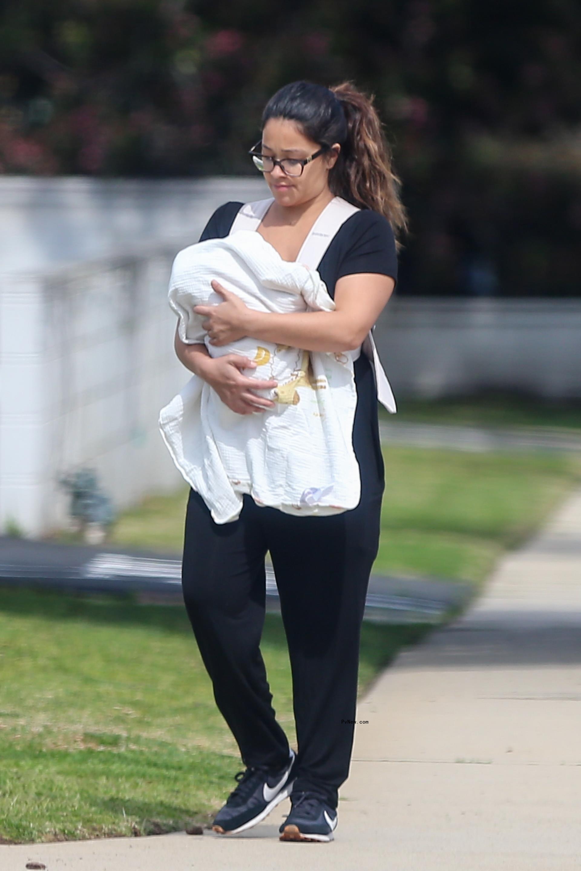 Gina Rodriguez walks with son