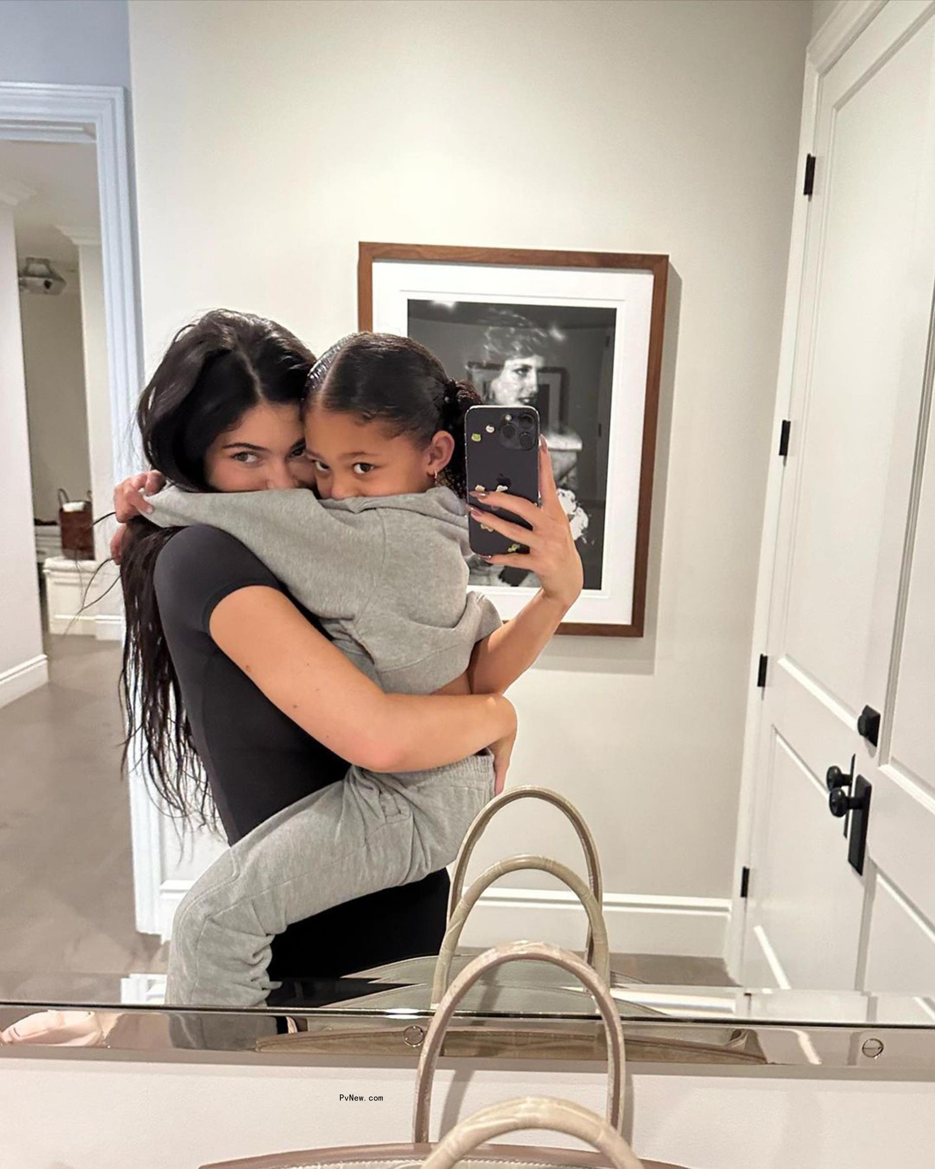 Kylie Jenner holds daughter Stormi in mirror selfie