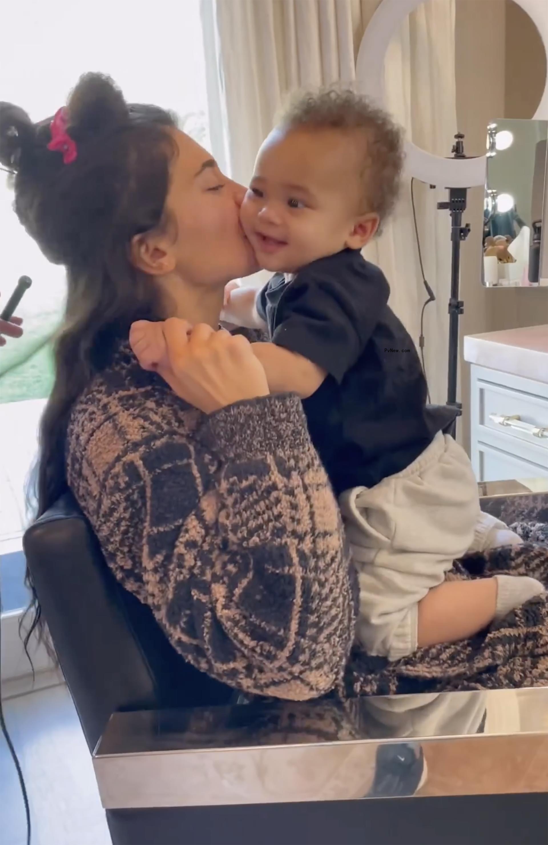Kylie Jenner kisses son Aire