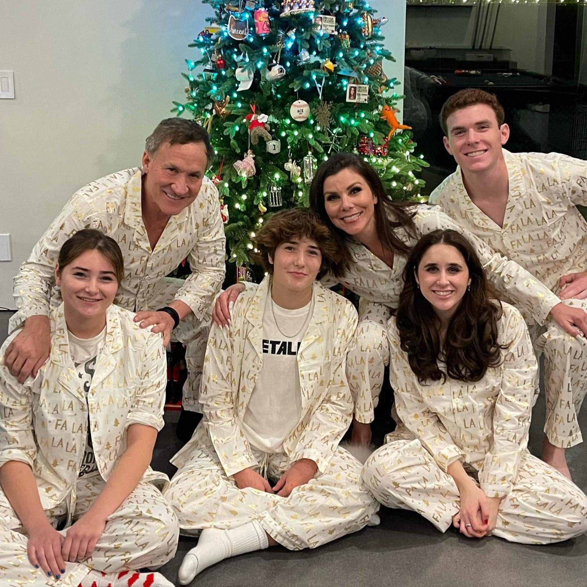 Heather Dubrow and Terry Dubrow in front of Christmas tree with four kids