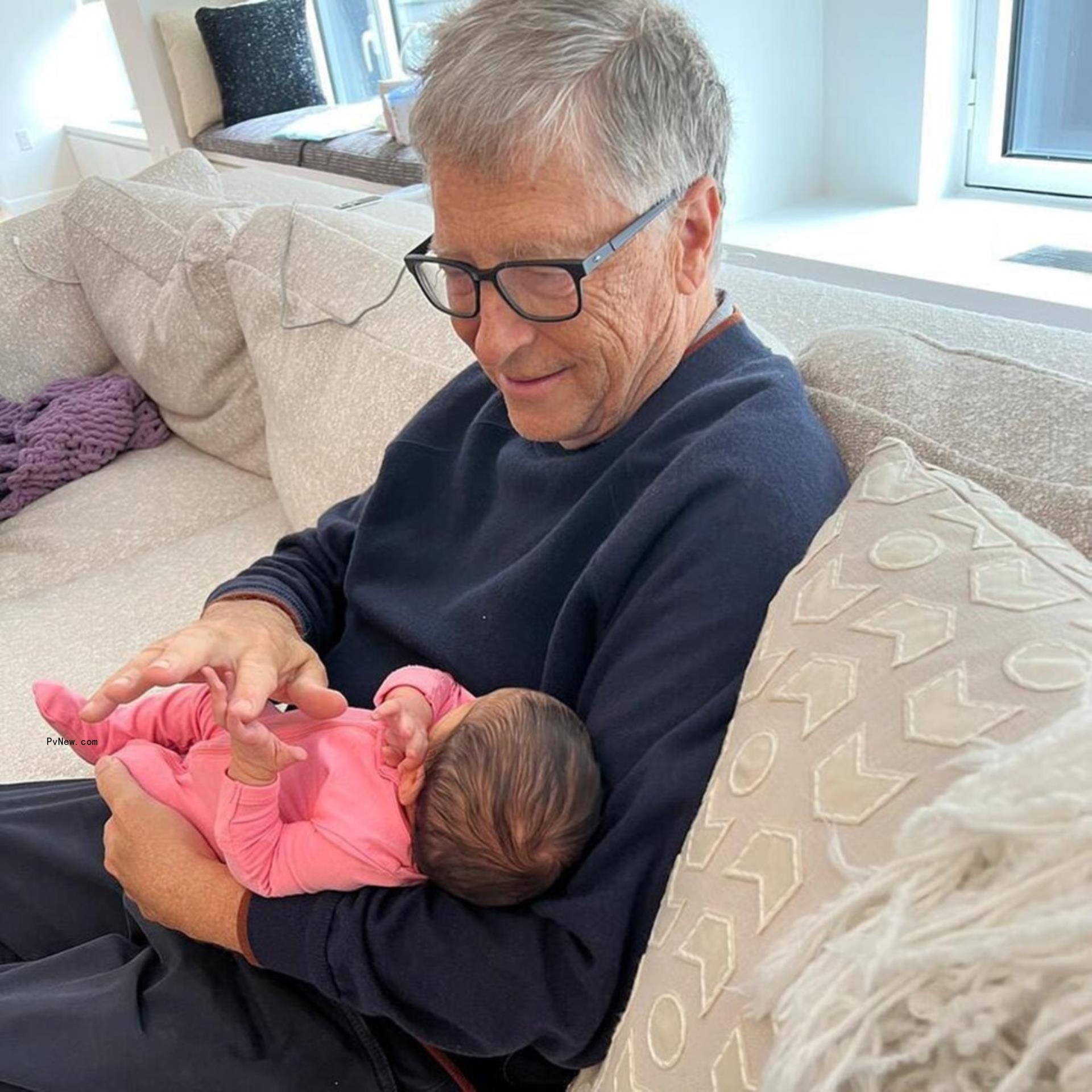 Bill Gates holding his granddaughter.