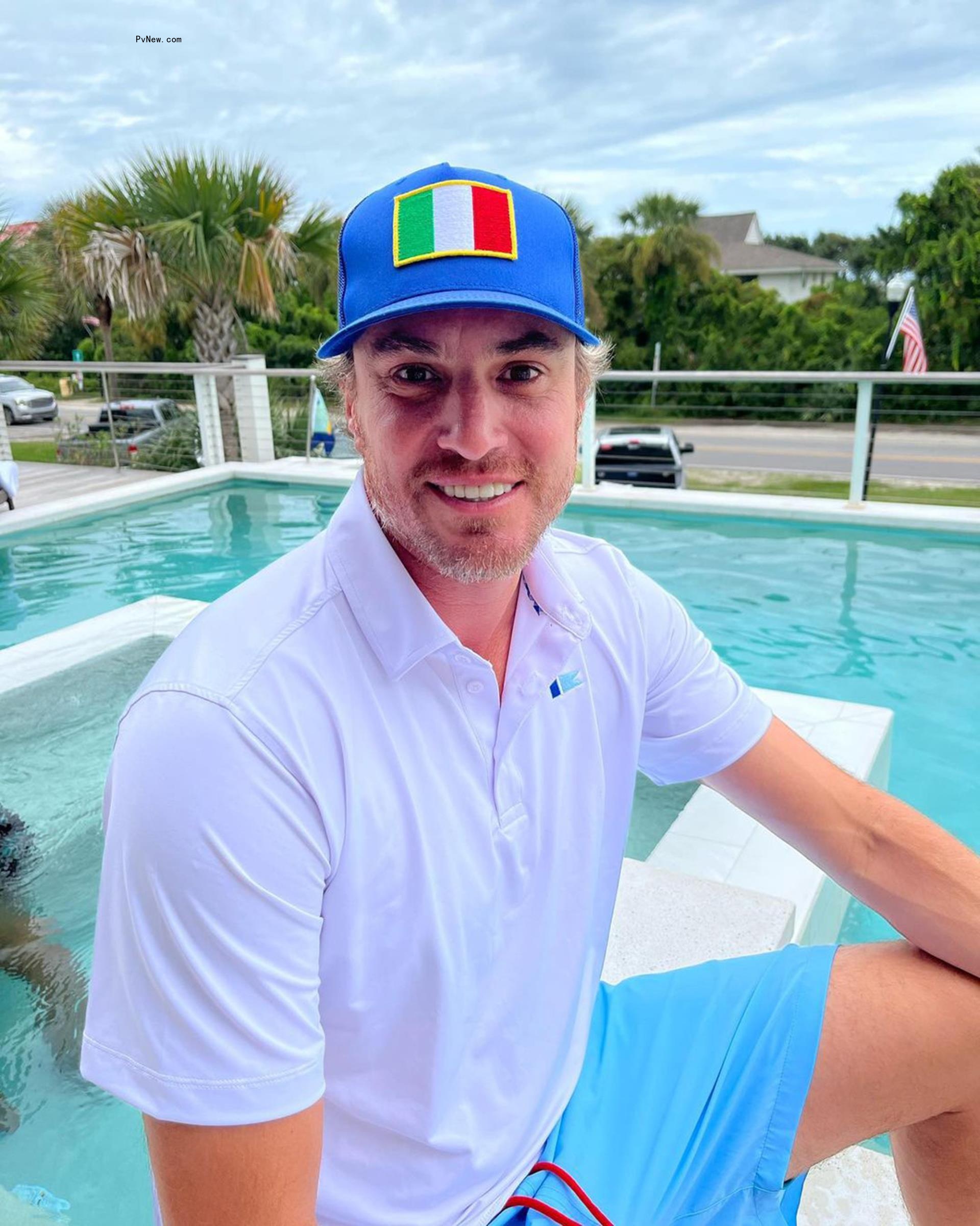 Shep Rose smiling near a pool.