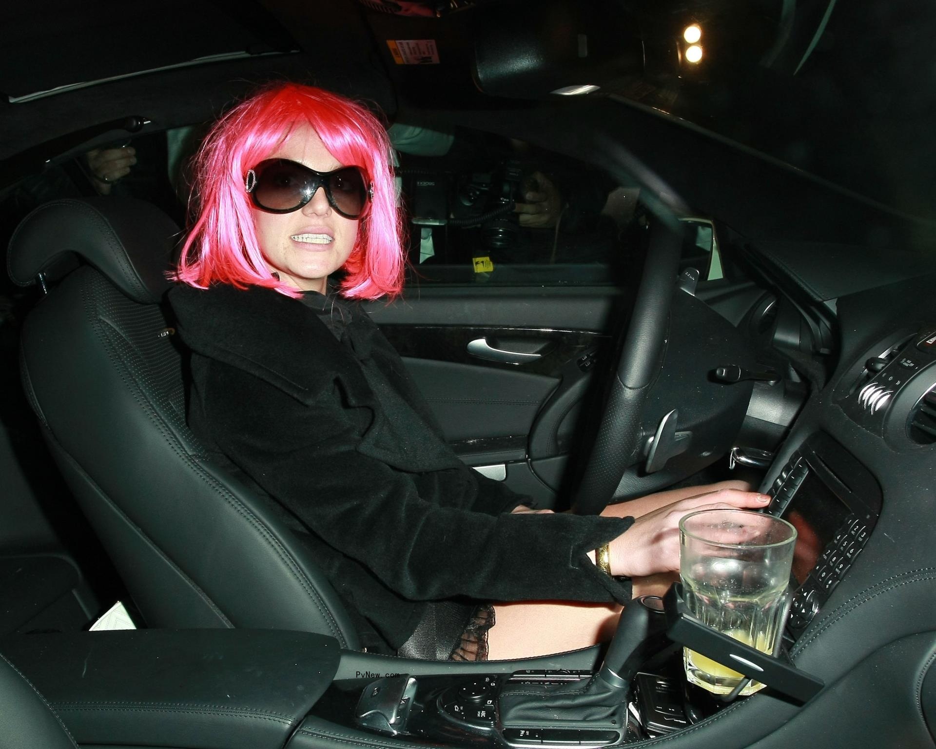 Britney Spears in car with pink wig on