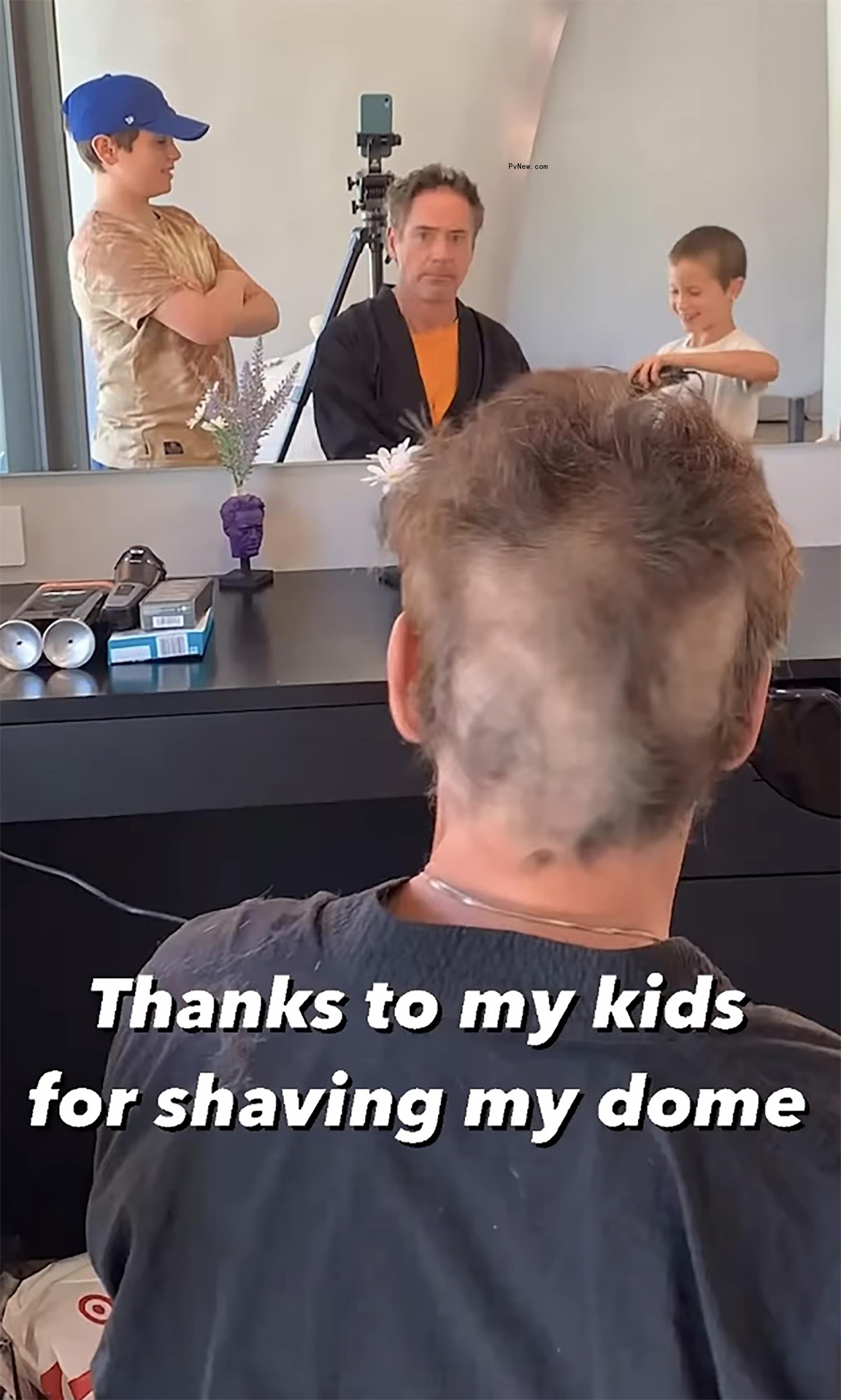 Robert Downey Jr.'s two kids shavin<i></i>g his head