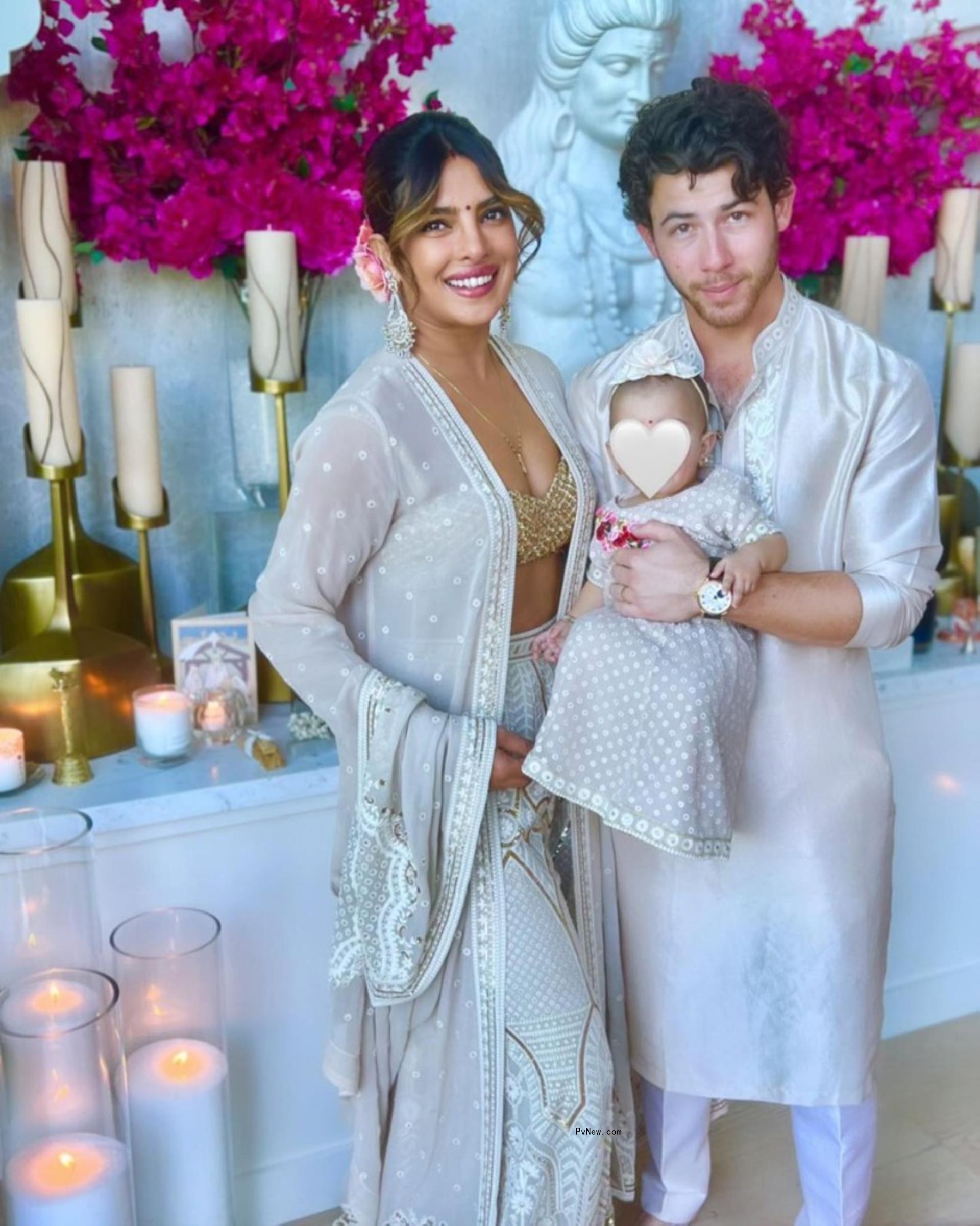 Priyanka Chopra and Nick Jo<i></i>nas holding daughter Malti.