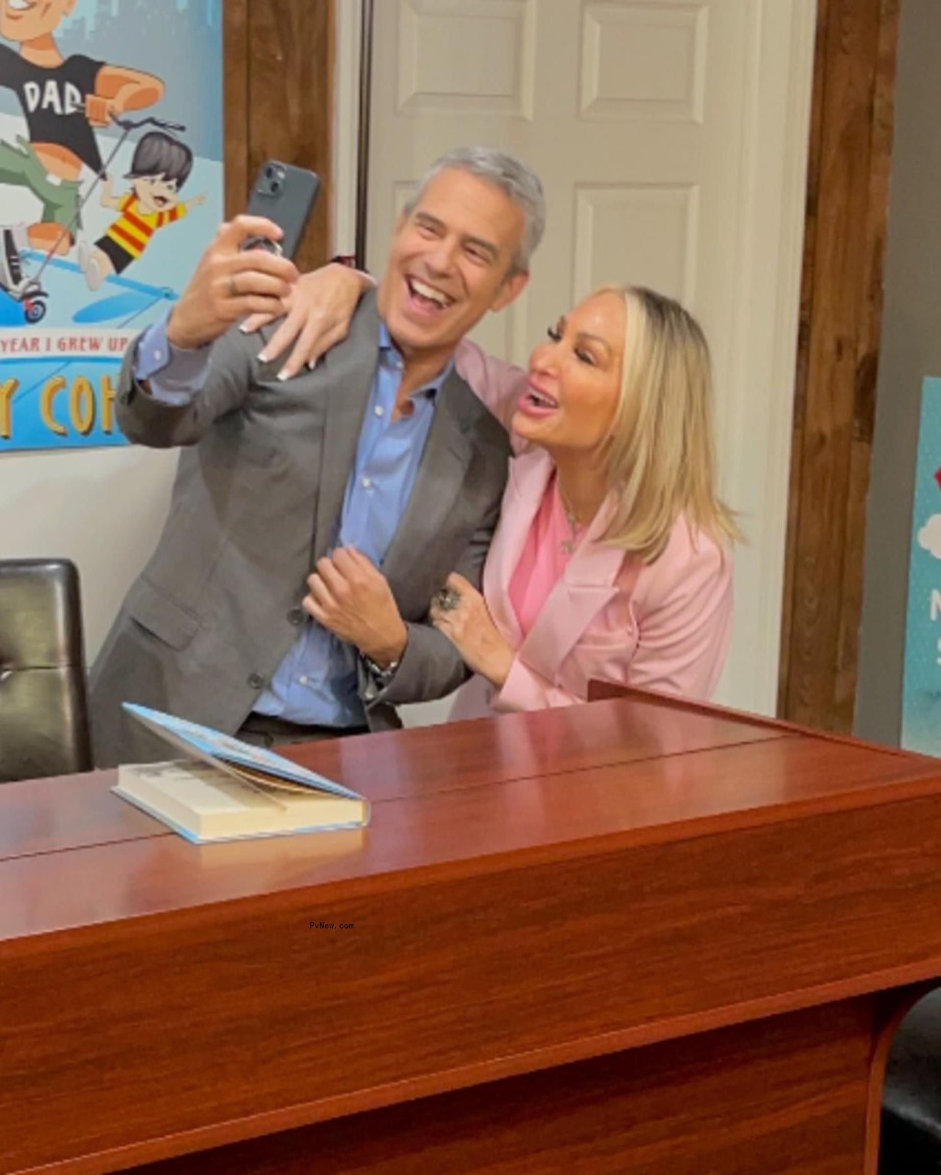 Andy Cohen and Kim DePaola taking a selfie