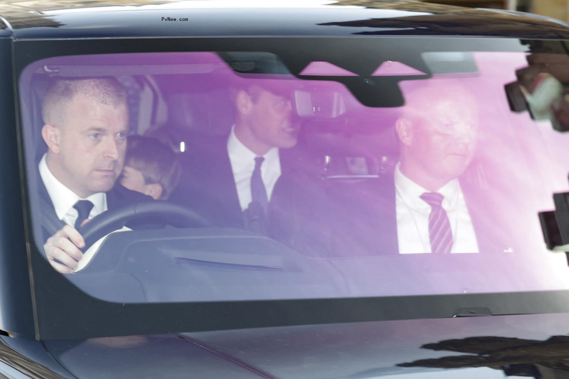 Prince William sits in backseat with Prince George