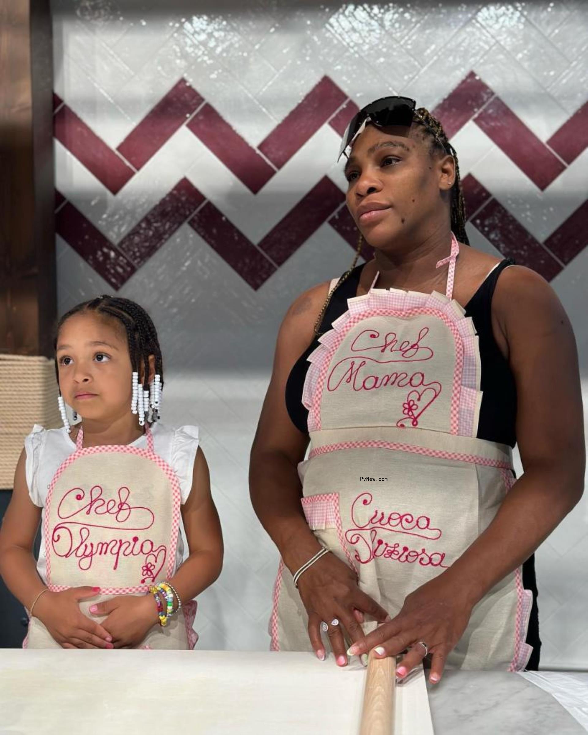 Serena Williams and Olympia Ohanian wearing aprons