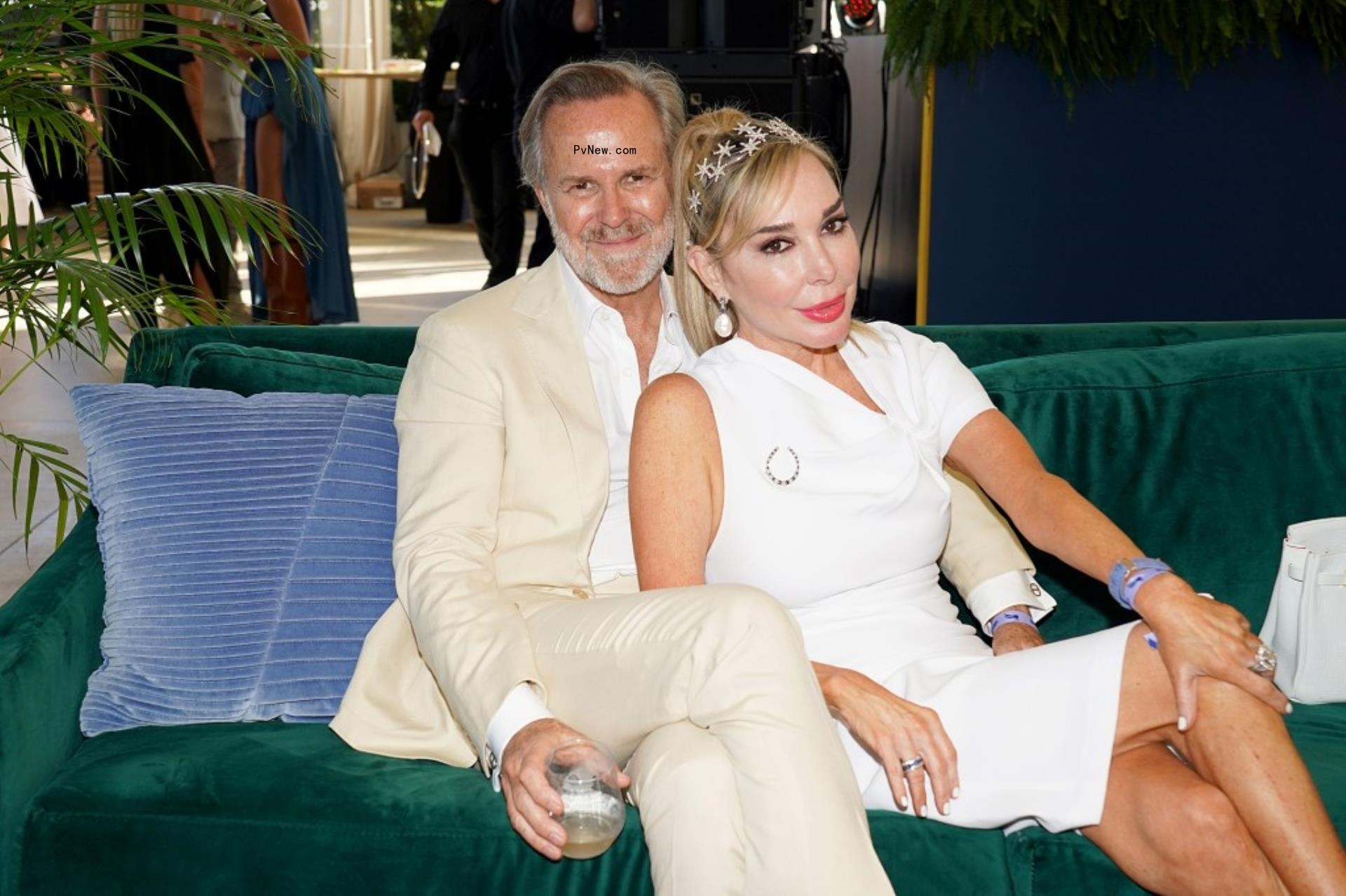 Marysol Patton and Steve McNamara sitting on a couch.