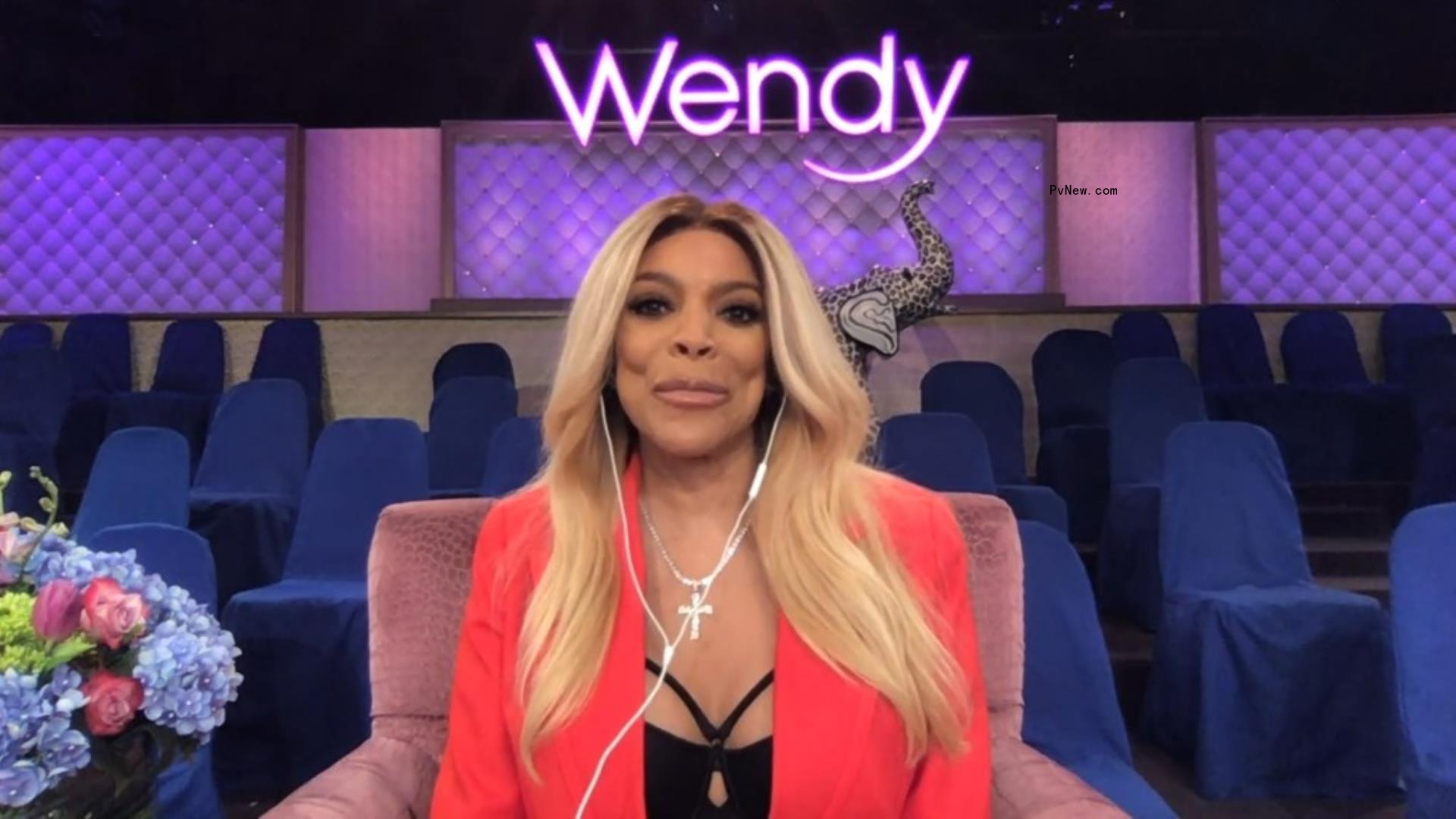 Wendy Williams sitting on her talk show set.