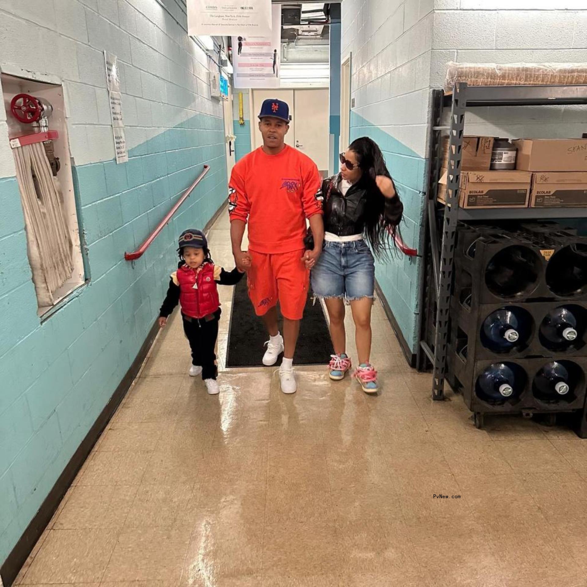 Nicki Minaj and Kenneth Petty walking with their son.