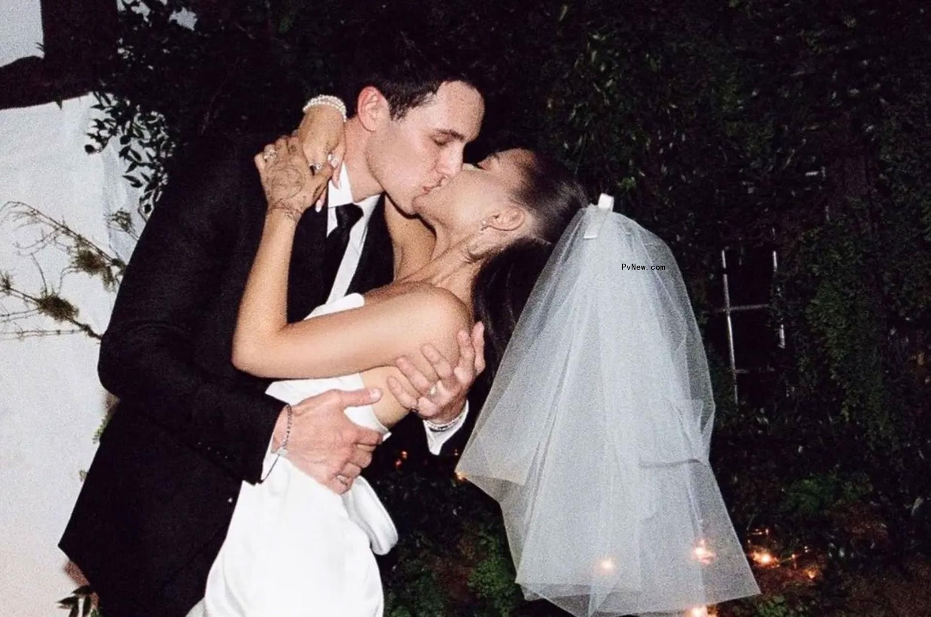 Ariana Grande and Dalton Gomez kissing on their wedding day.