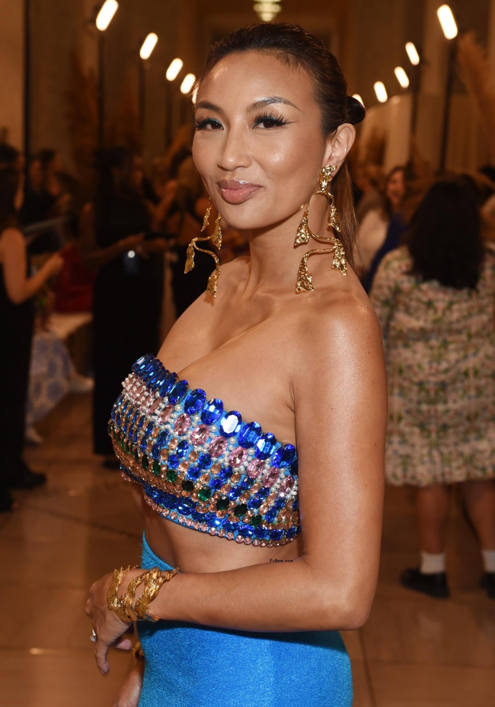 Jeannie Mai in sparkly blue tube top.