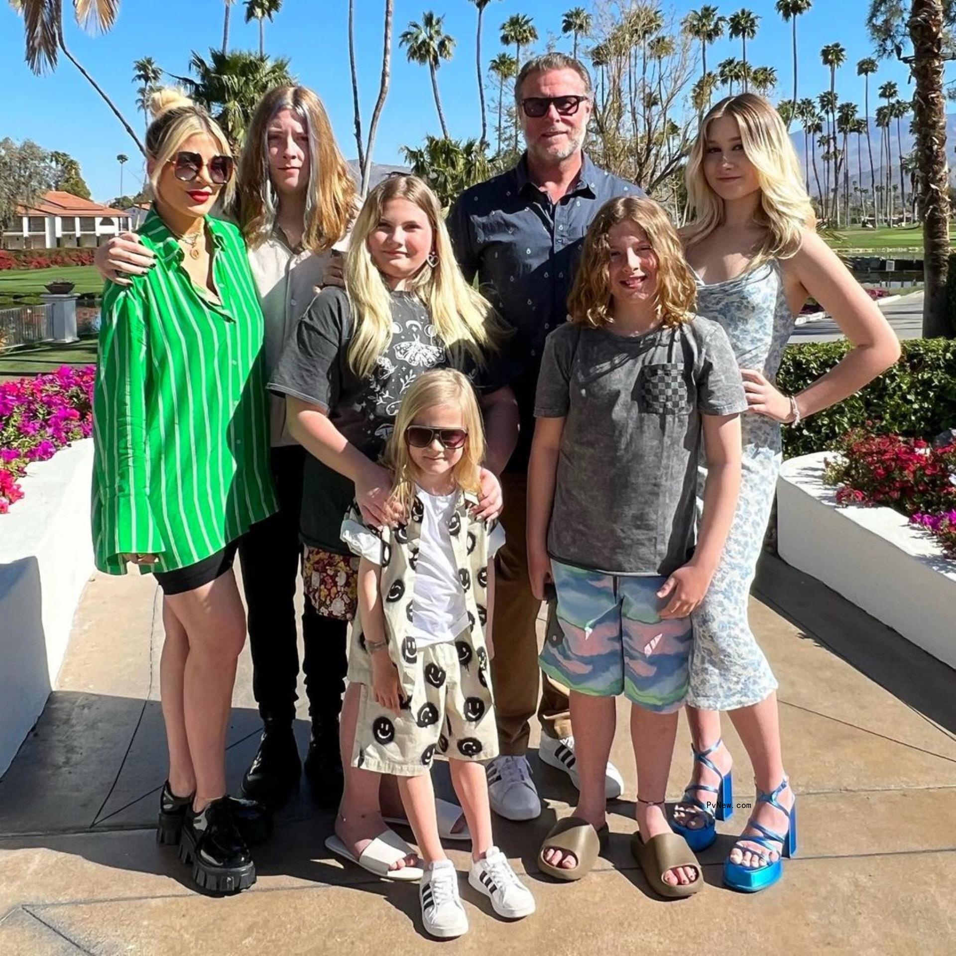 Tori Spelling and Dean McDermott posing with their kids.