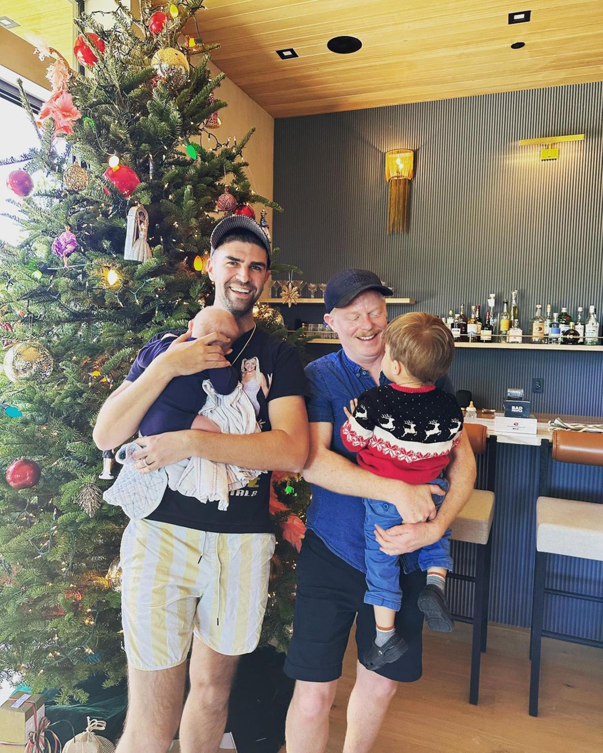 Jesse Tyler Ferguson and Justin Mikita with their two sons.