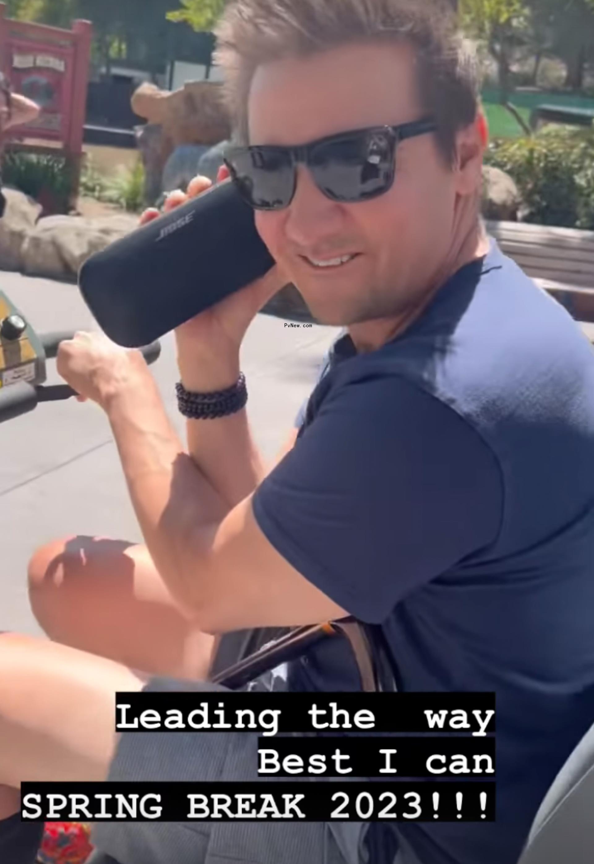 Jeremy Renner on an electric scooter at Six Flags.