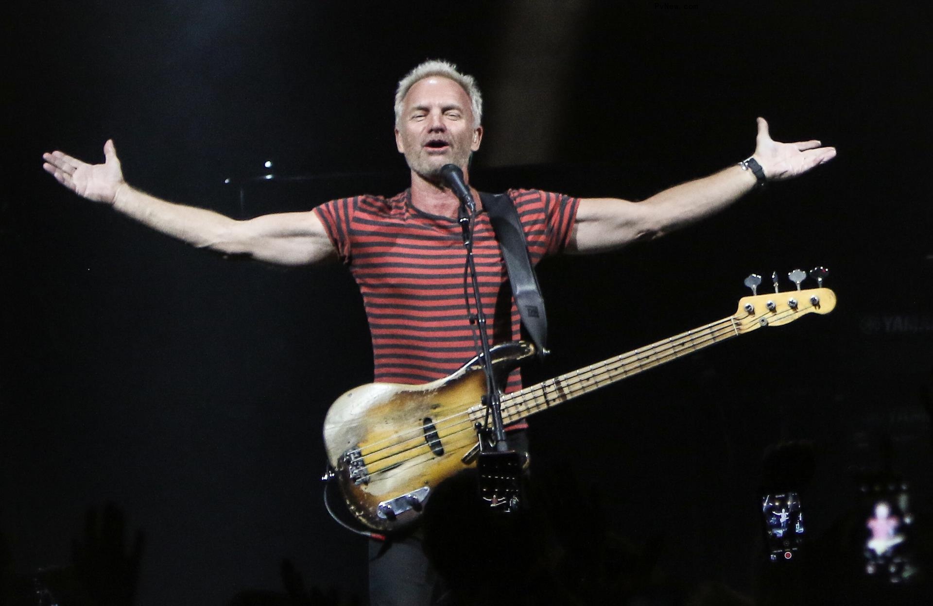 Sting performing onstage