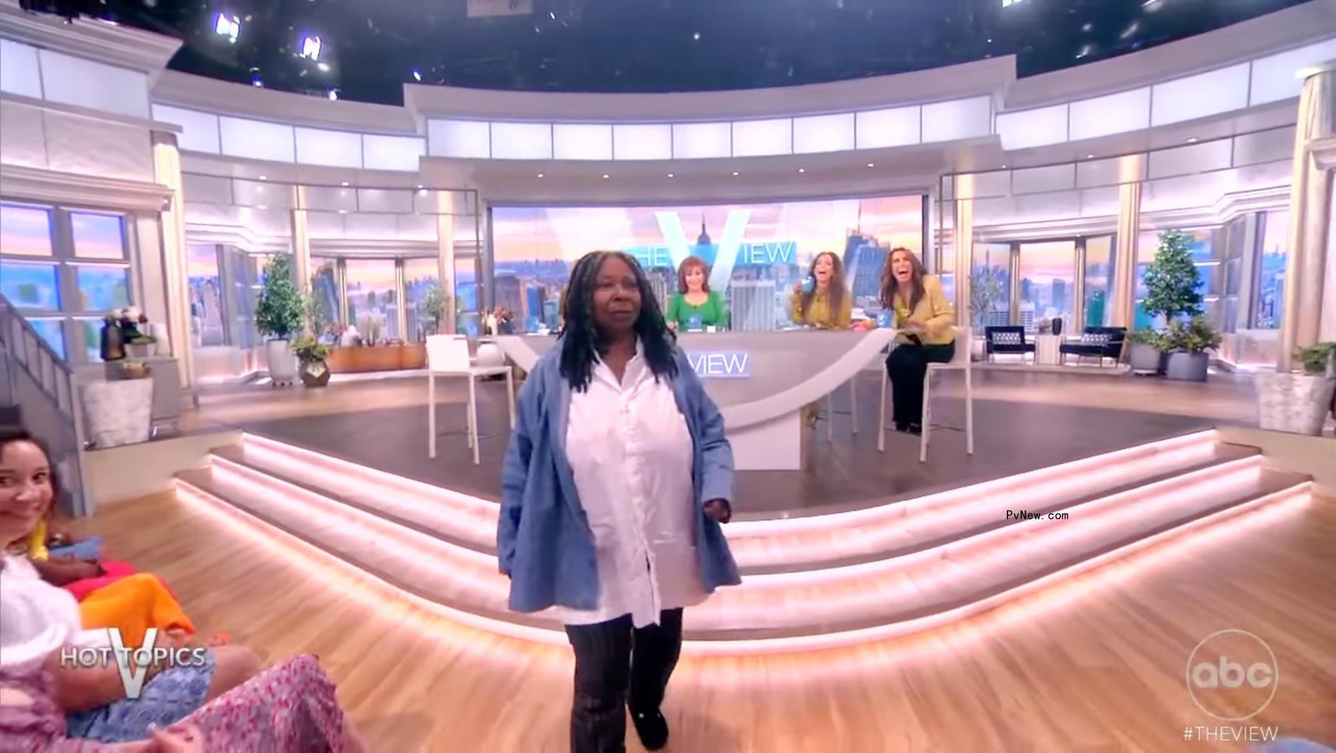 Whoopi Goldberg walking on 