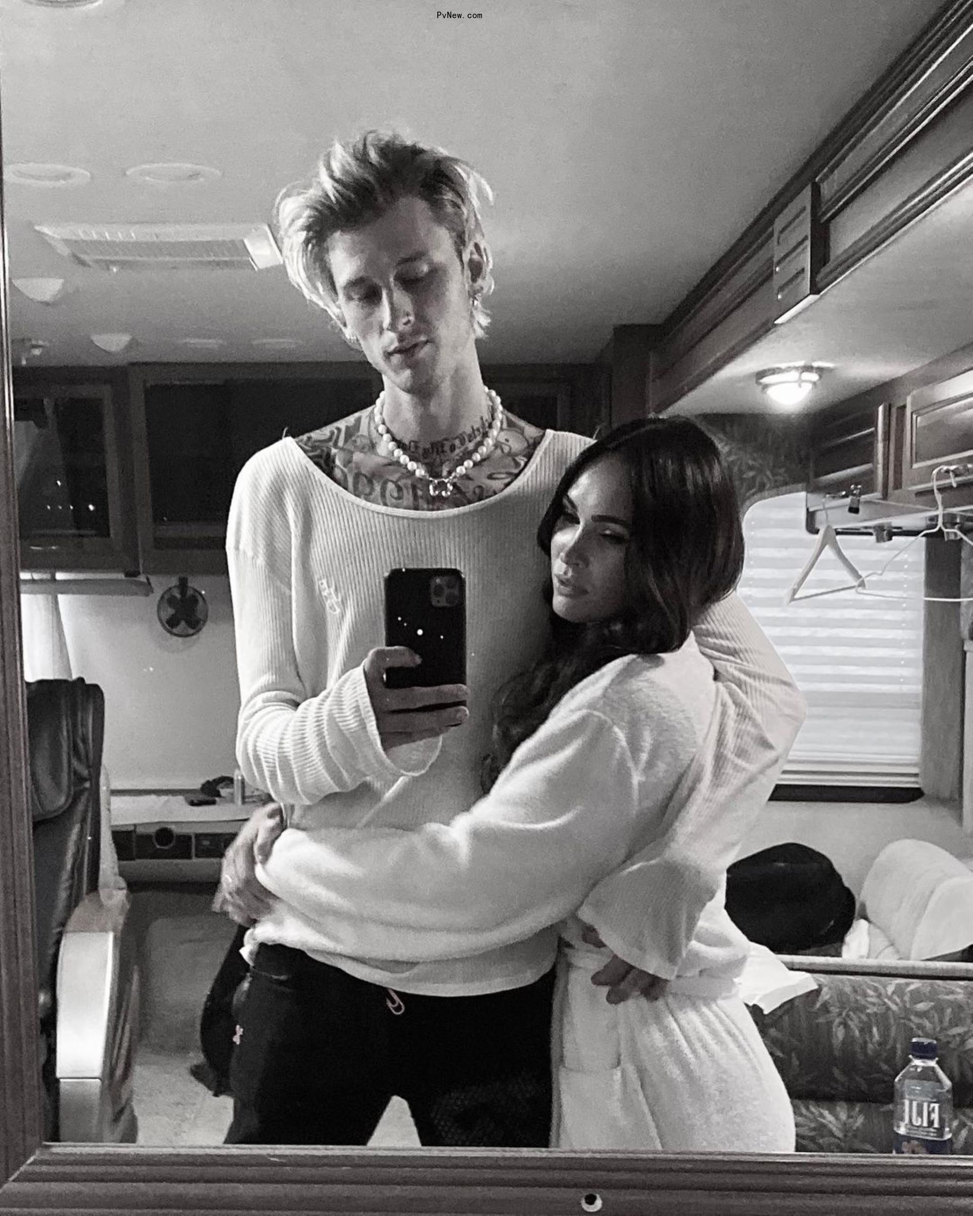 Machine Gun Kelly and Megan Fox black and white mirror selfie.