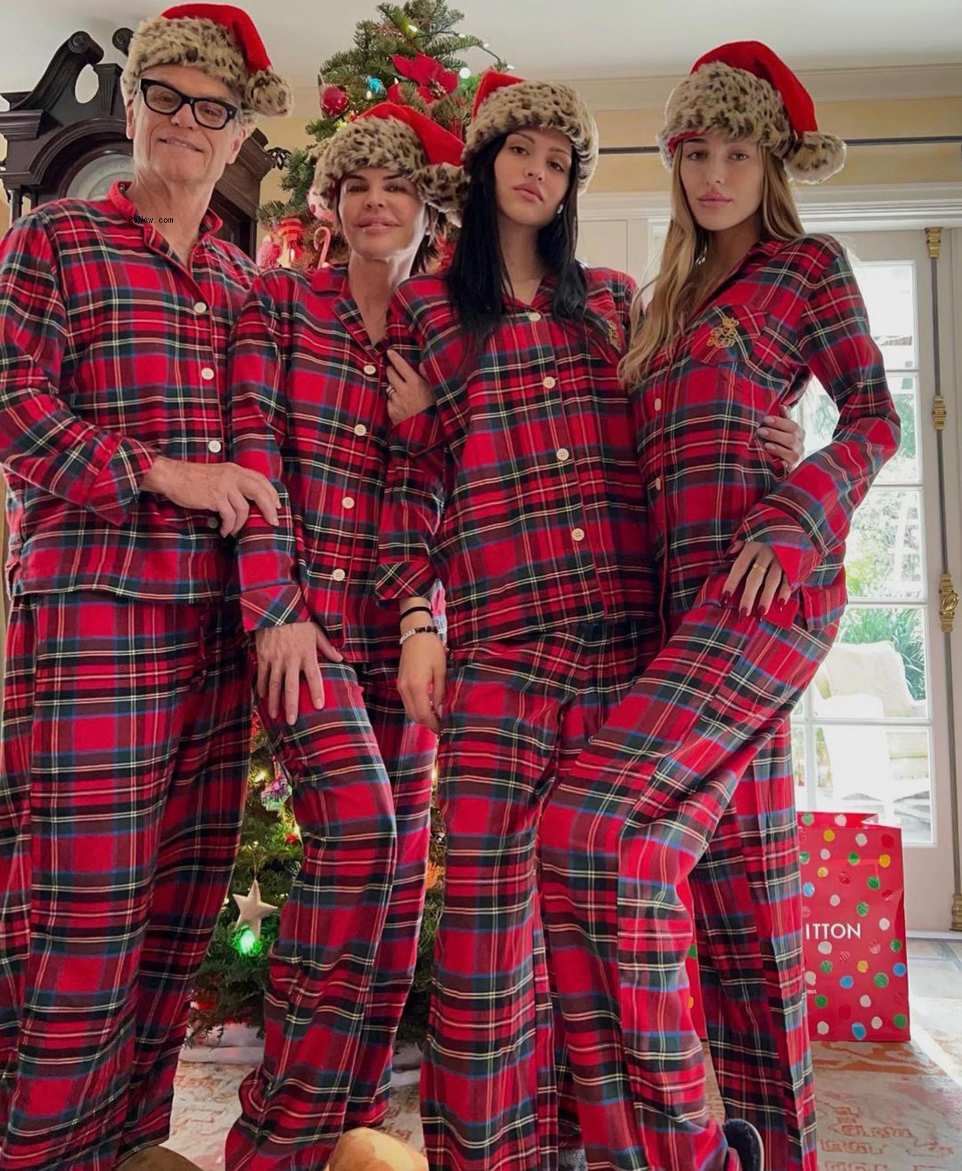 Harry Hamlin, Lisa Rinna, Amelia Hamlin and Delilah Hamlin posing together in holiday pajamas