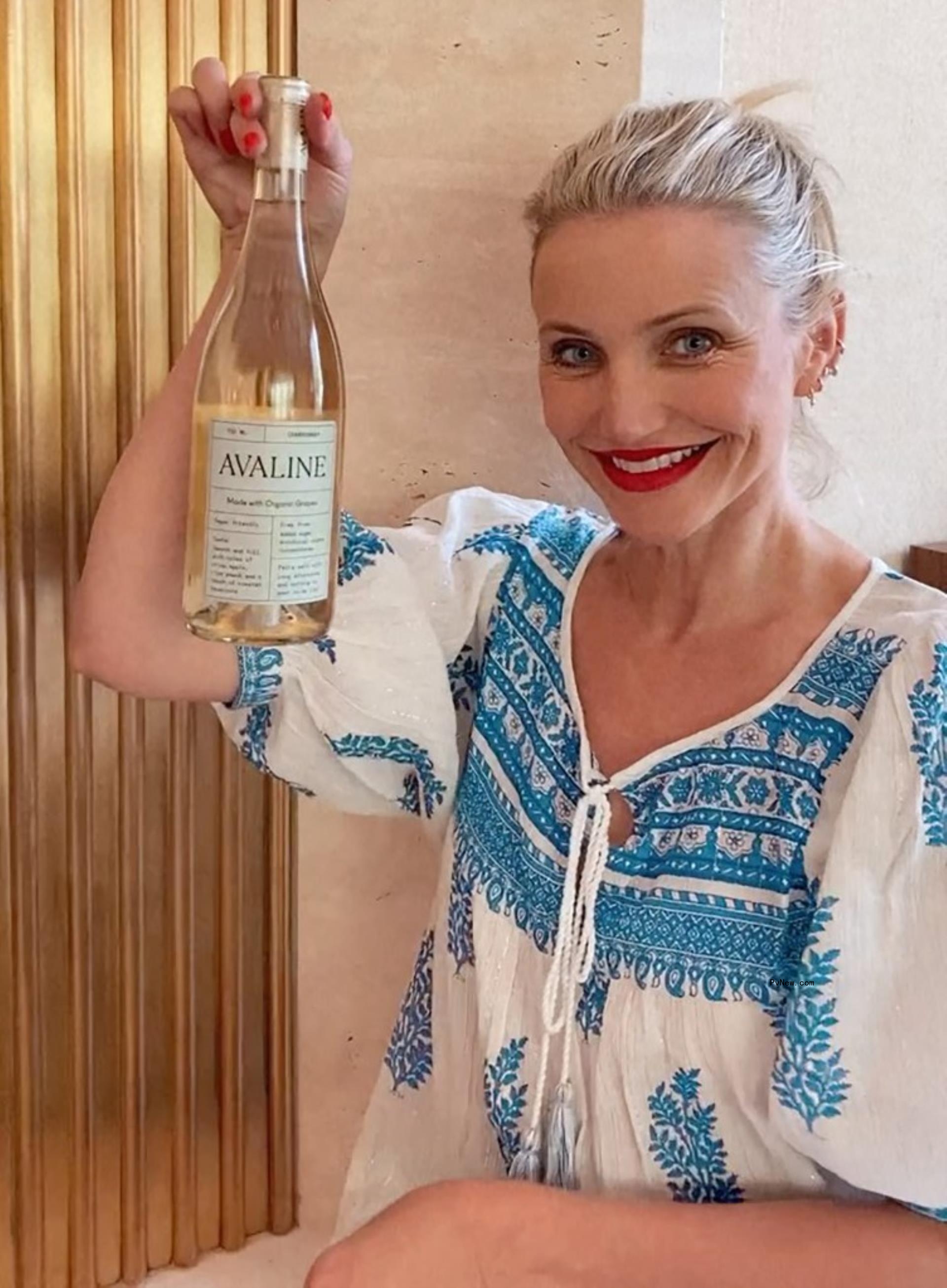 Cameron Diaz holding a bottle of Avaline wine.