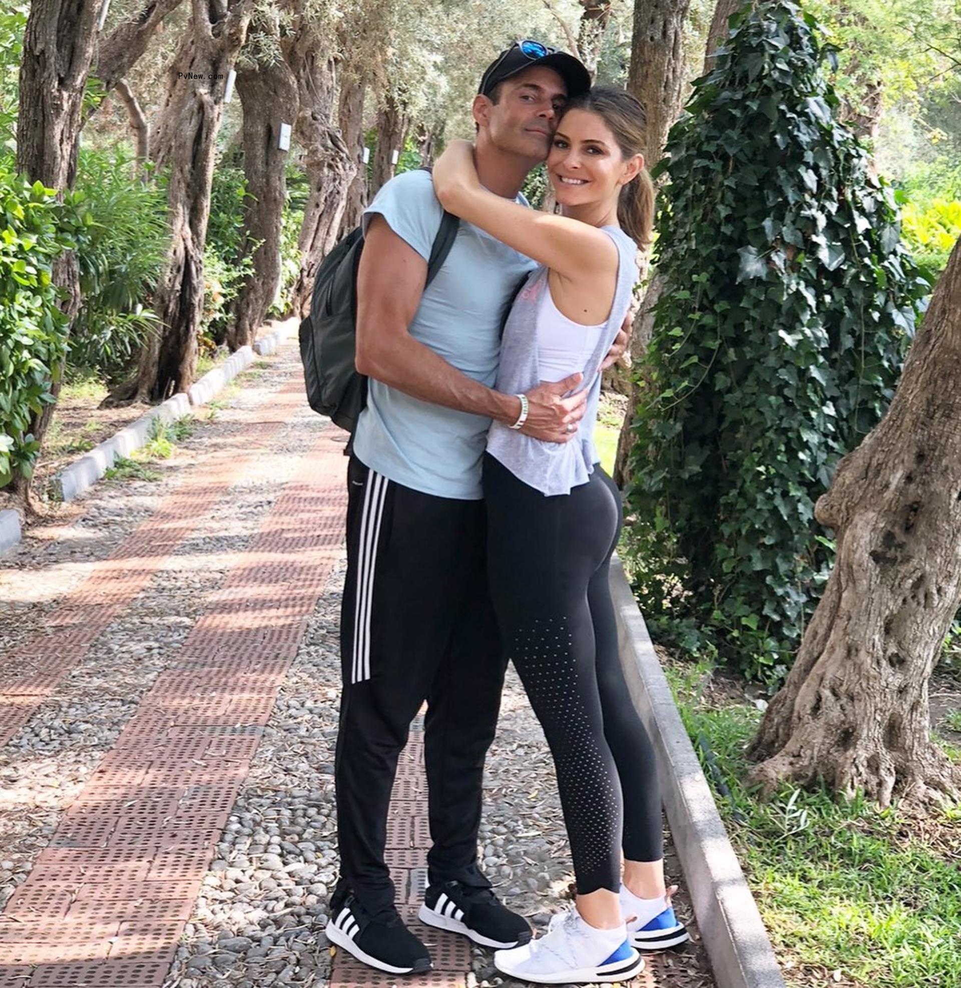 Maria Menounos and Keven Undergaro hug on hike