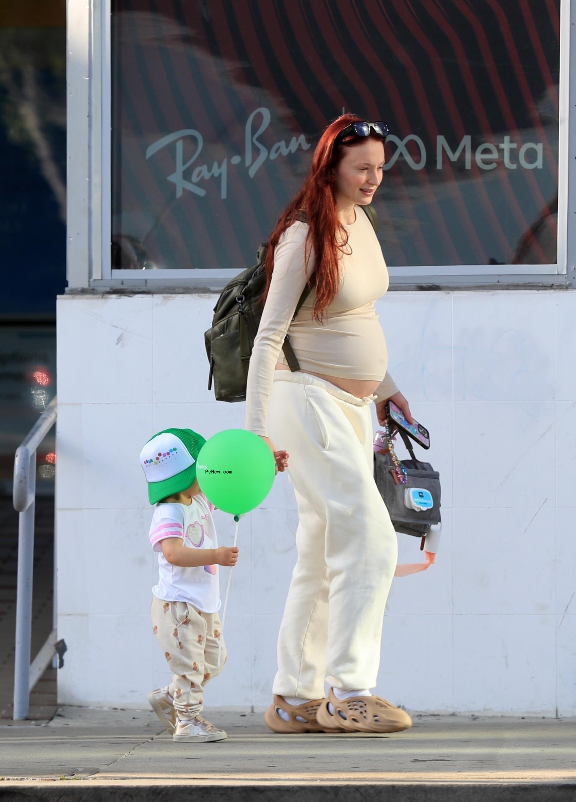Sophie Turner walking her daughter