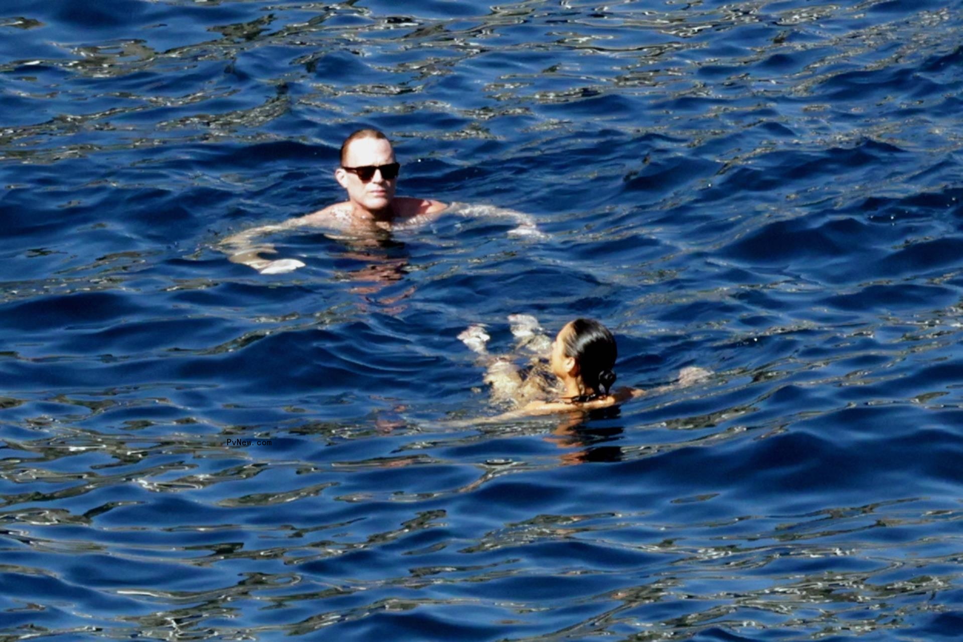 Jennifer Co<i></i>nnelly in the water with Paul Bettany.