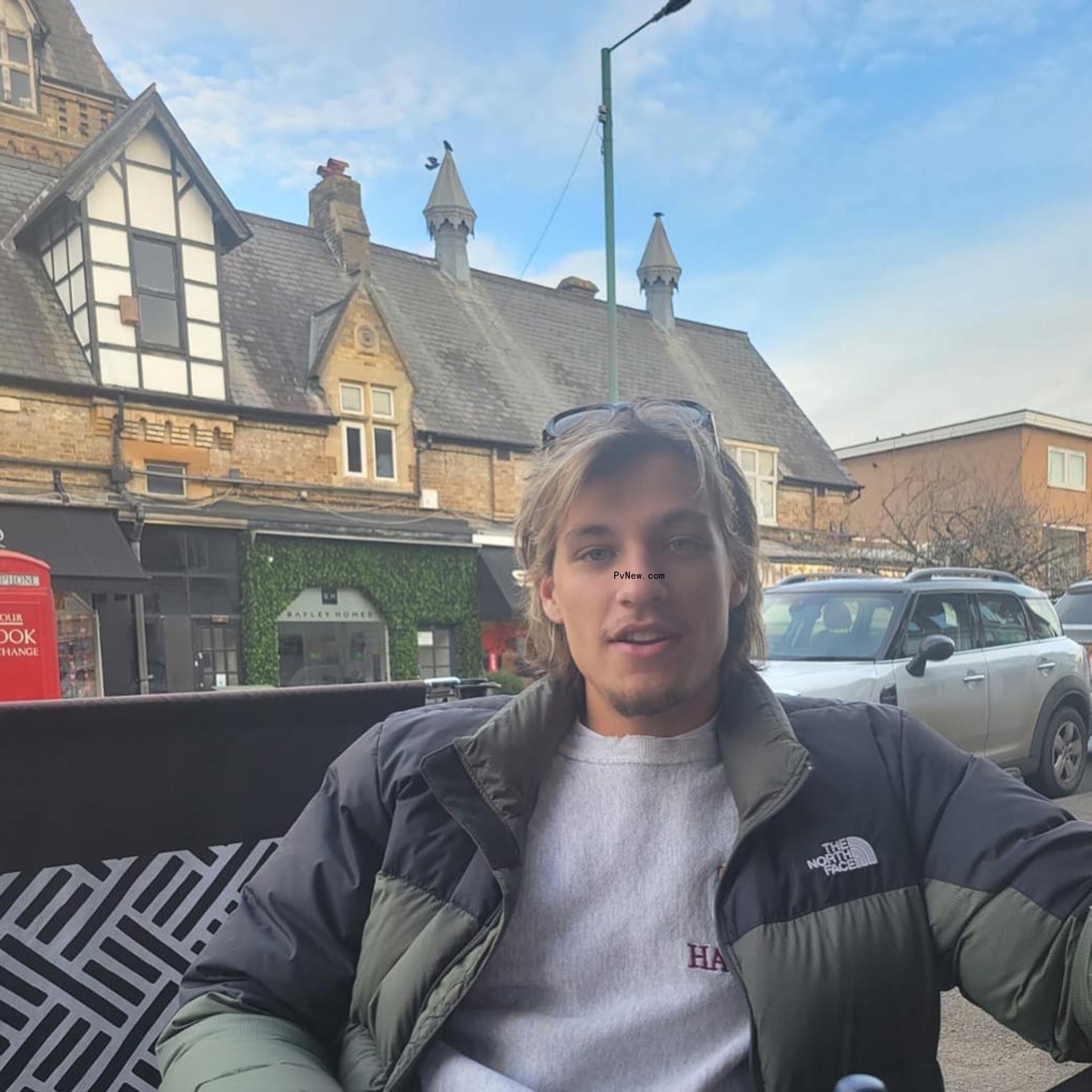 Jake Bo<i></i>ngiovi sitting down at a table.