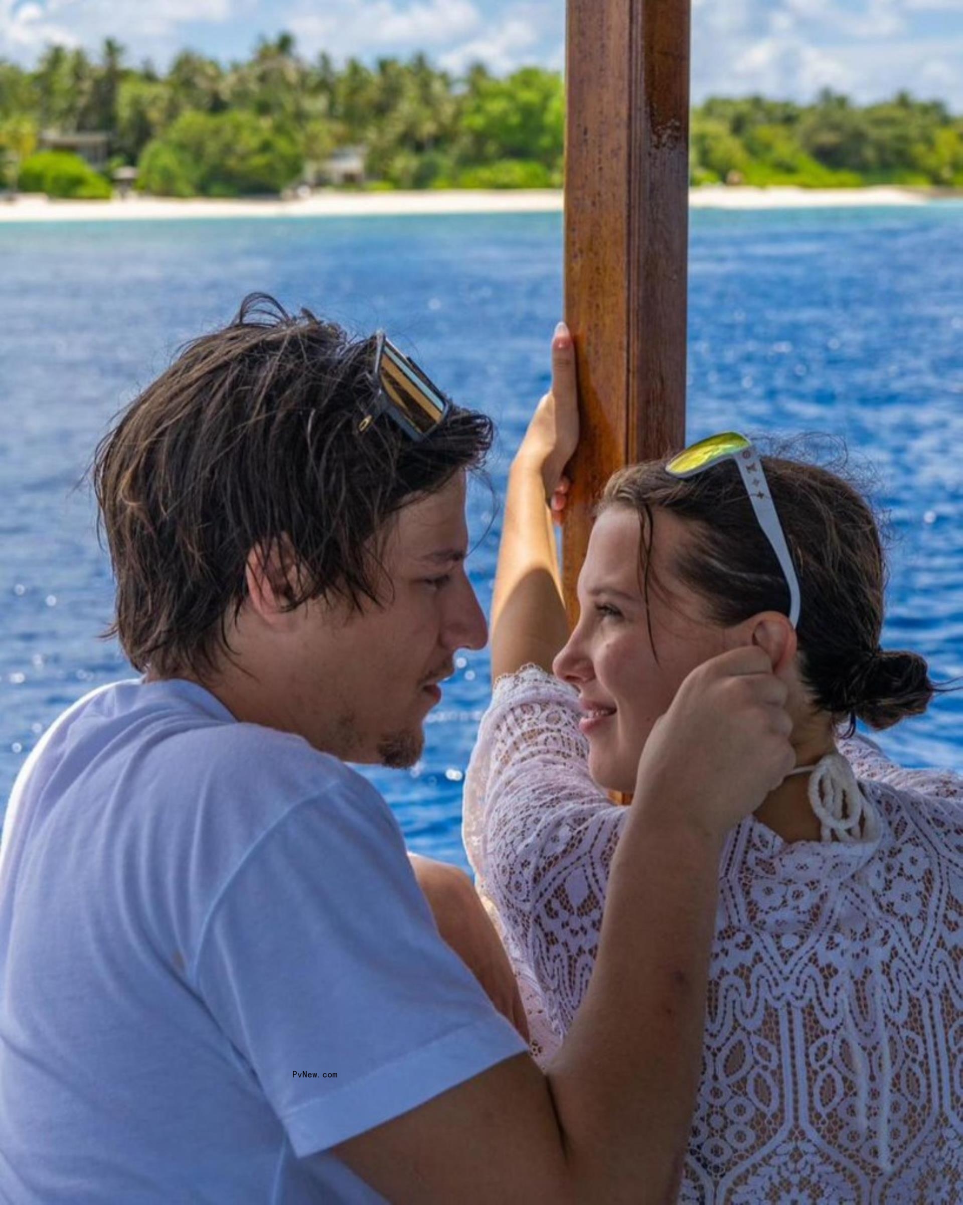 Millie Bobby Brown looking into Jake Bongiovi's eyes.