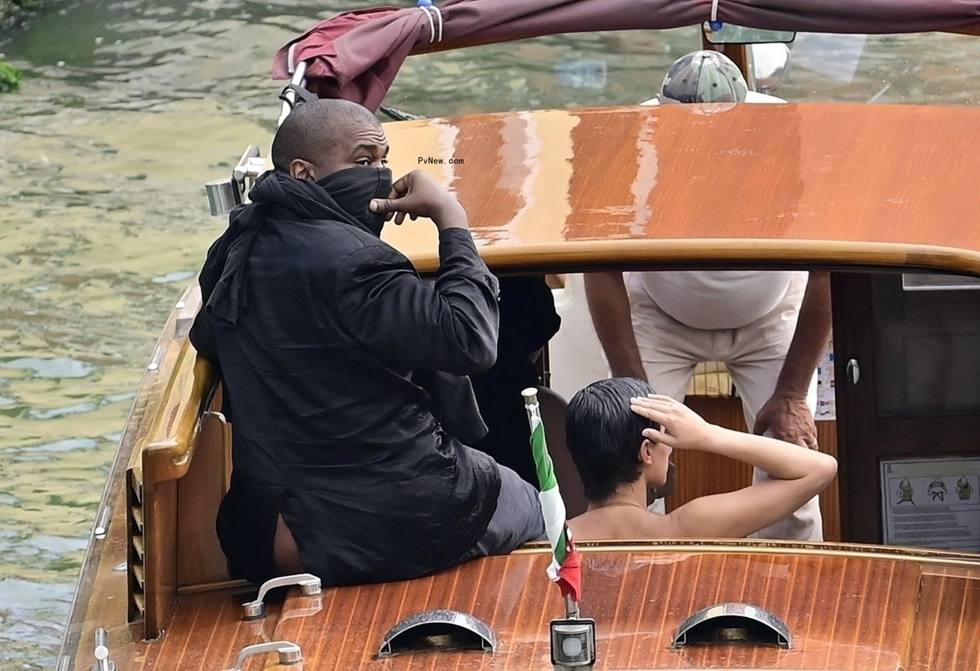 Kanye West and Bianca Censori on a boat in Italy.