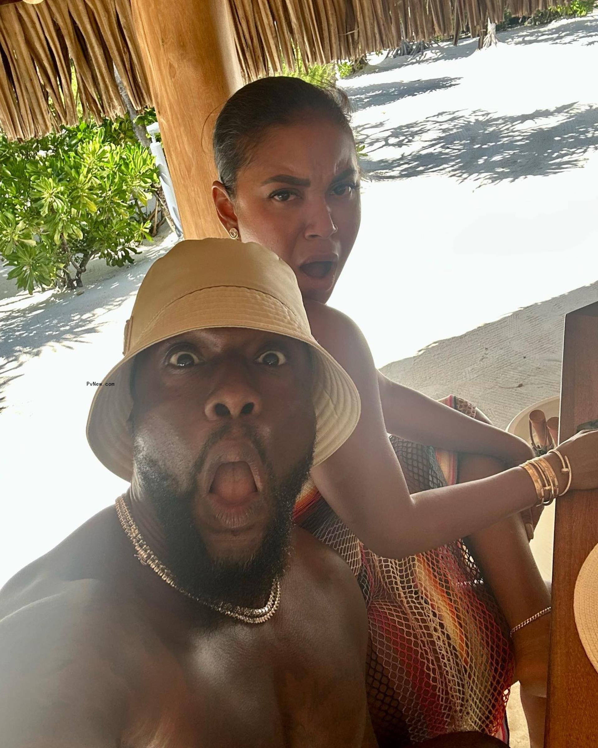 Kevin Hart and his wife, Eniko Hart, making silly faces.