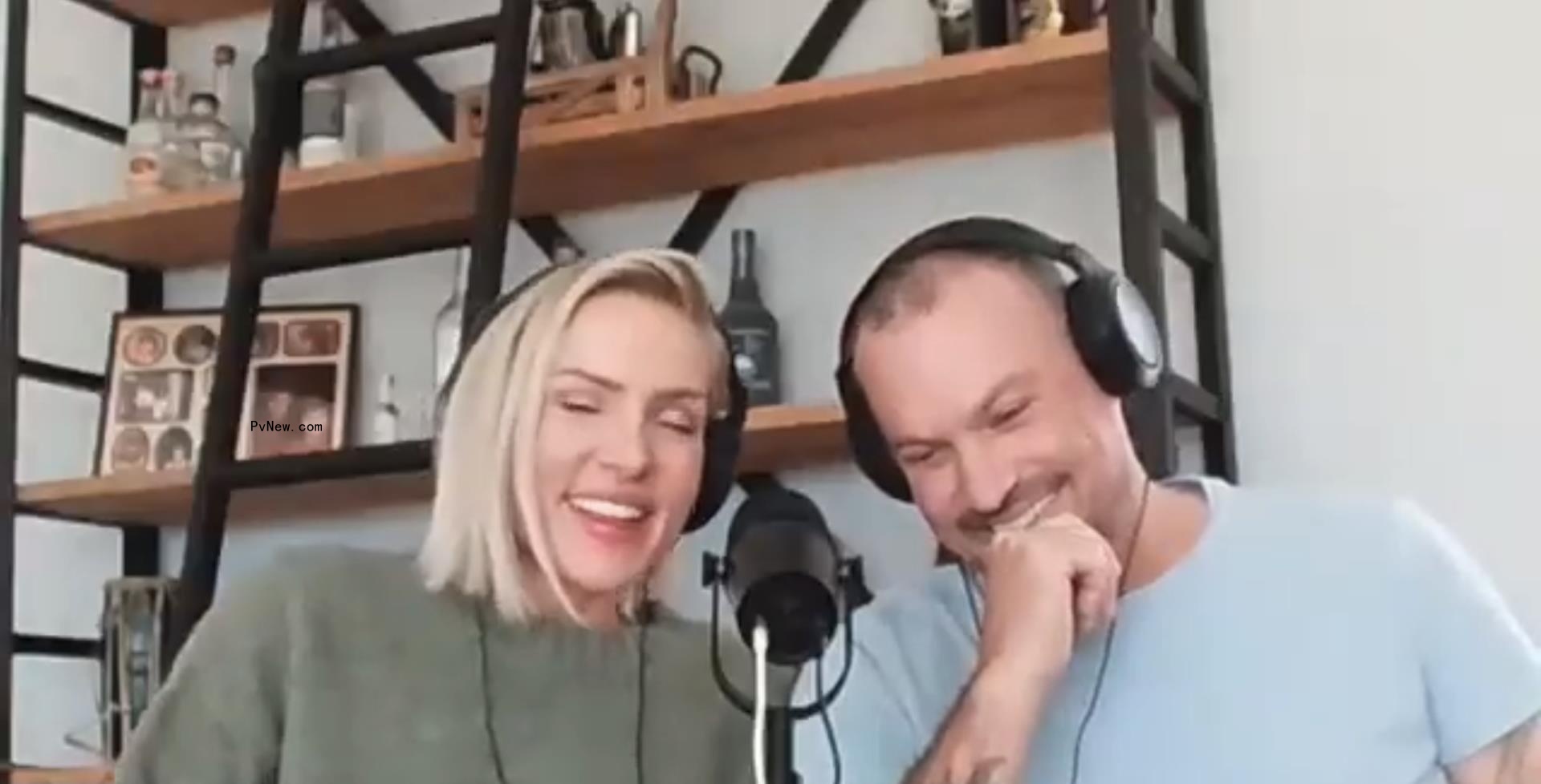 A photo of Brian Austin Green and Sharna Burgess talking to Pvnew