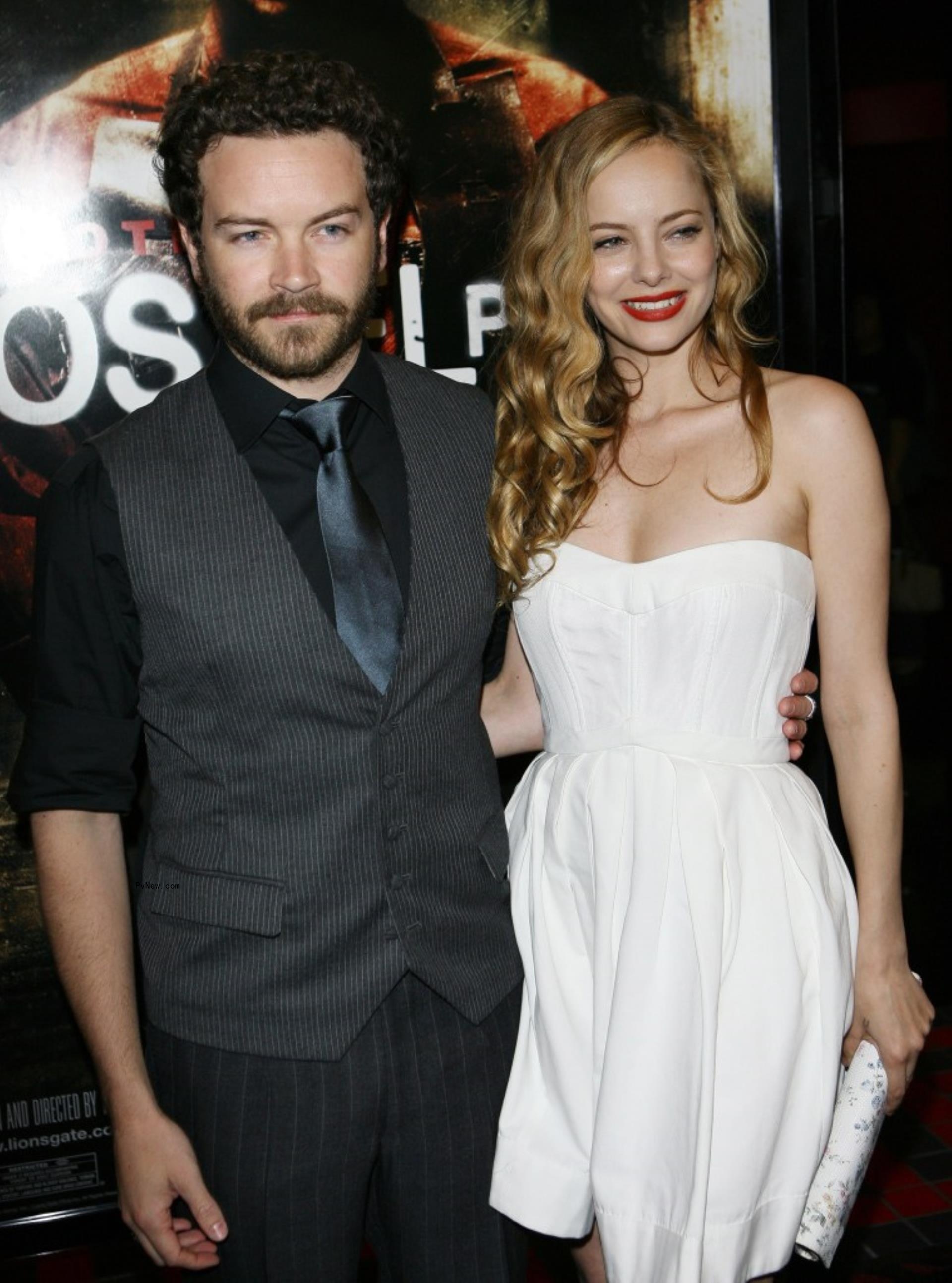 Bijou Phillips and Danny Masterson on a red carpet.