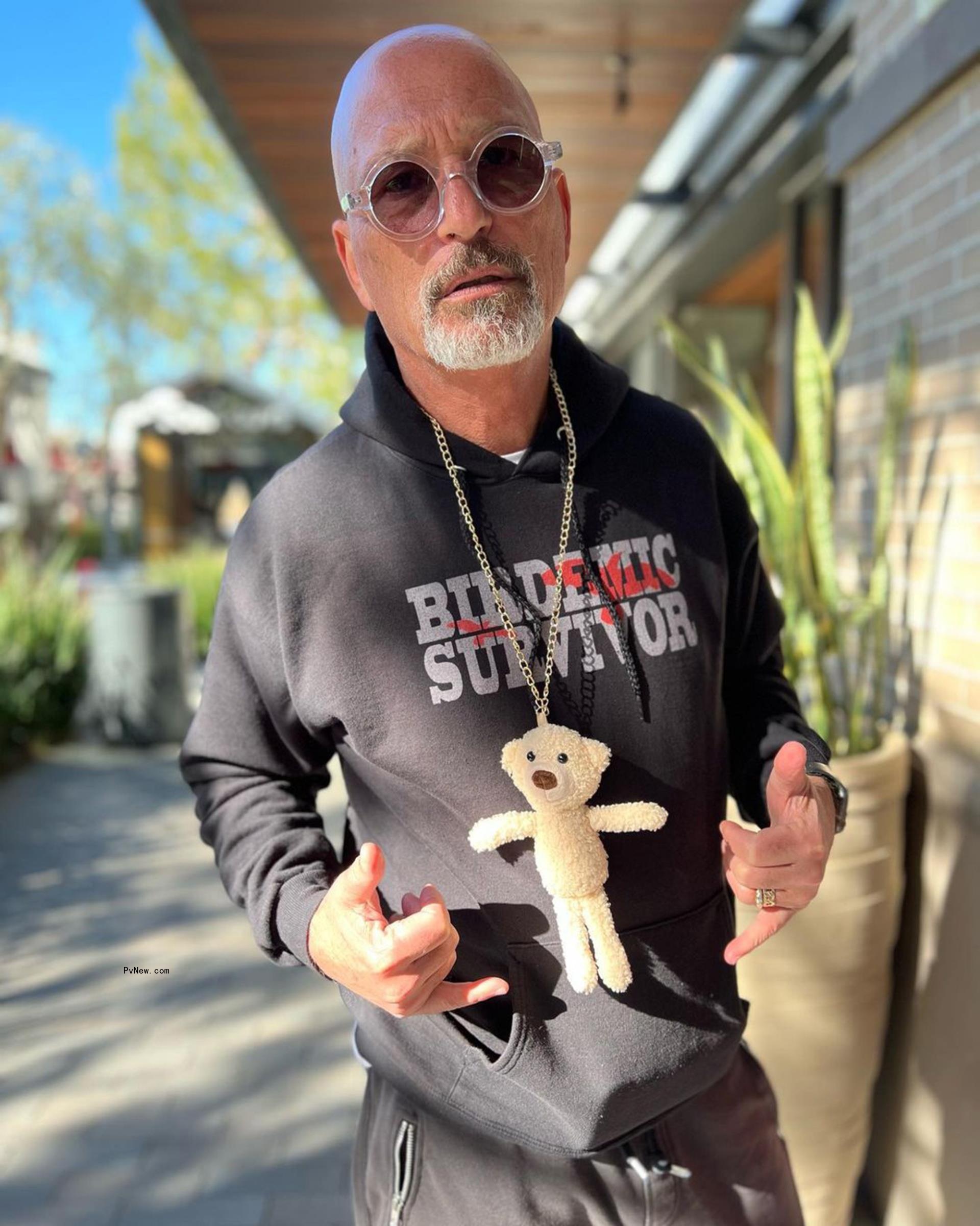 Howie Mandel poses in hoodie
