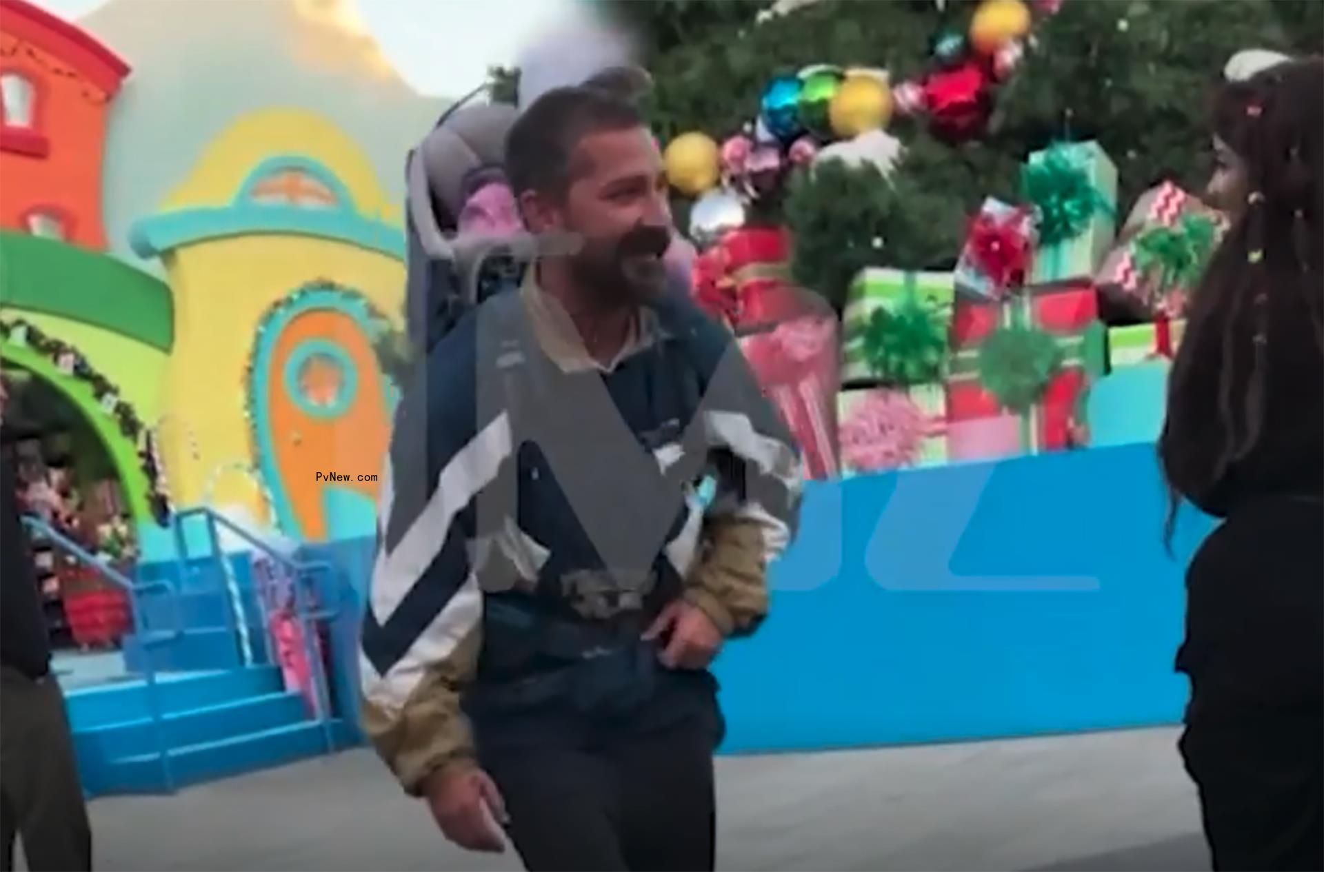 Shia LaBeouf walking with his daughter