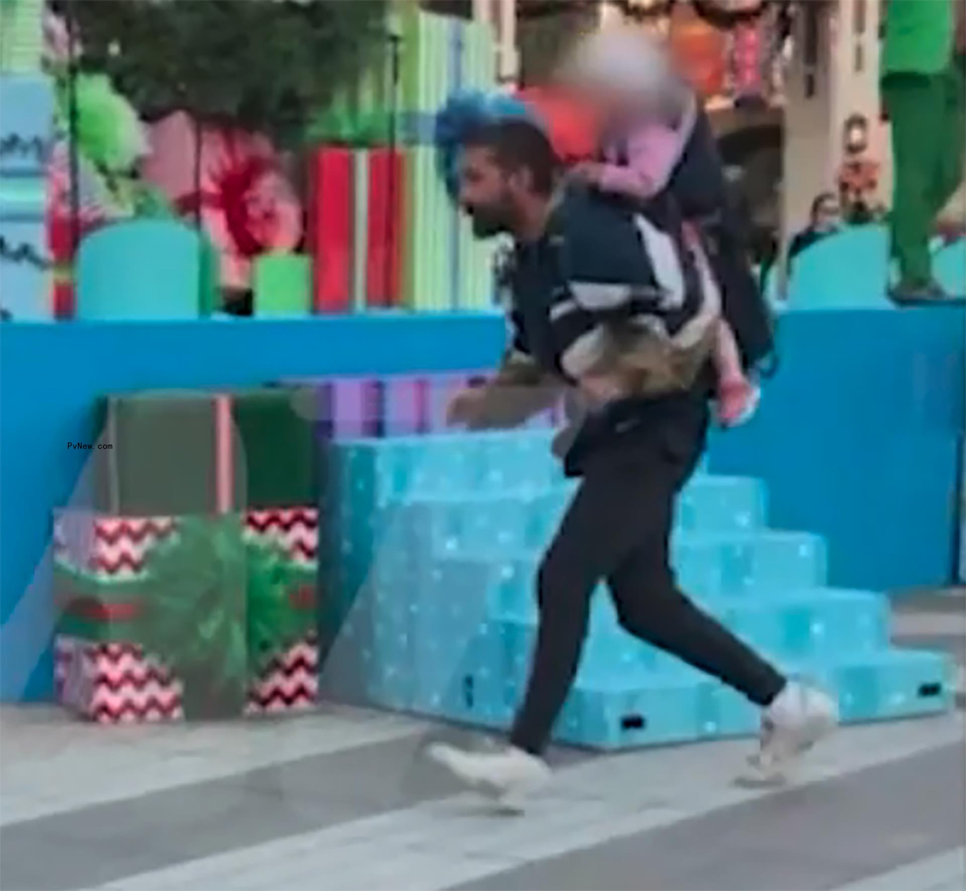 Shia LaBeouf running with his daughter