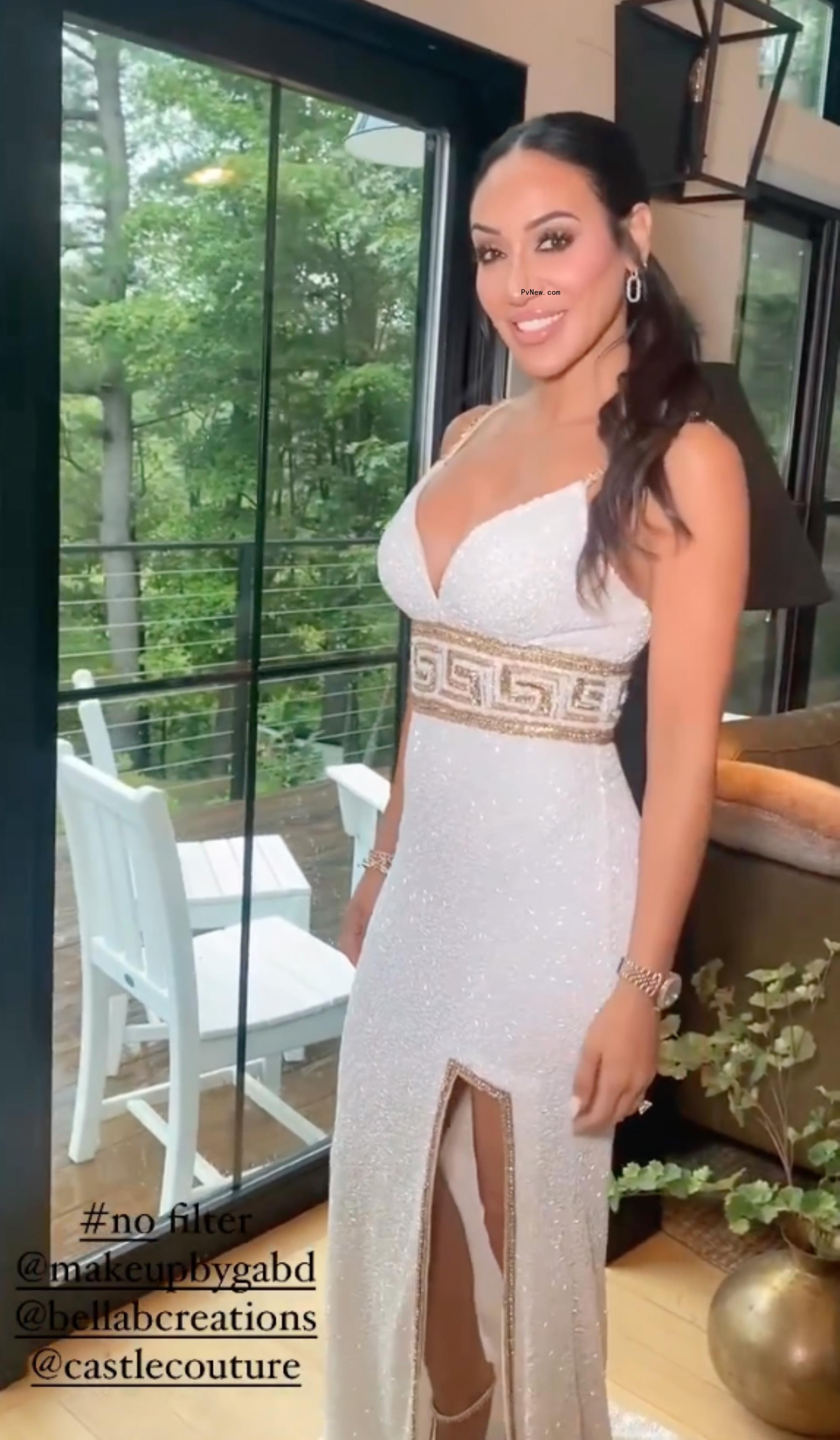 Melissa Gorga posing in a white dress
