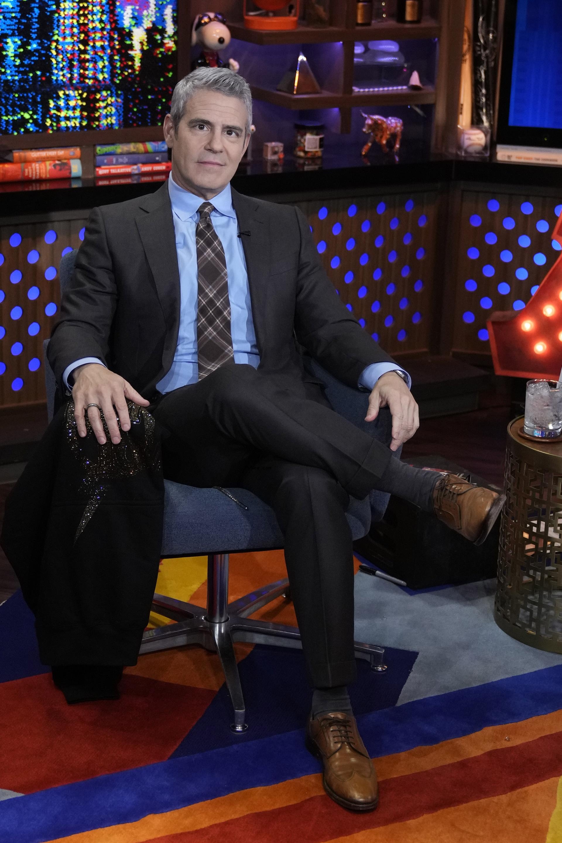 Andy Cohen sitting on