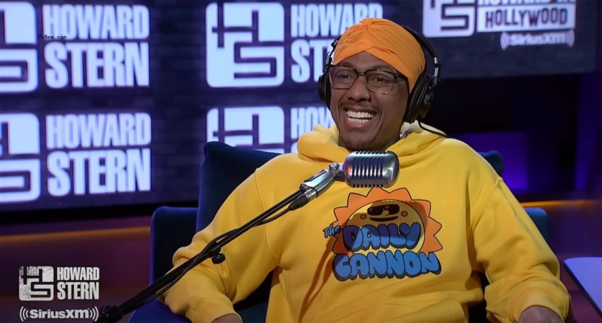 Nick Cannon talks into mic