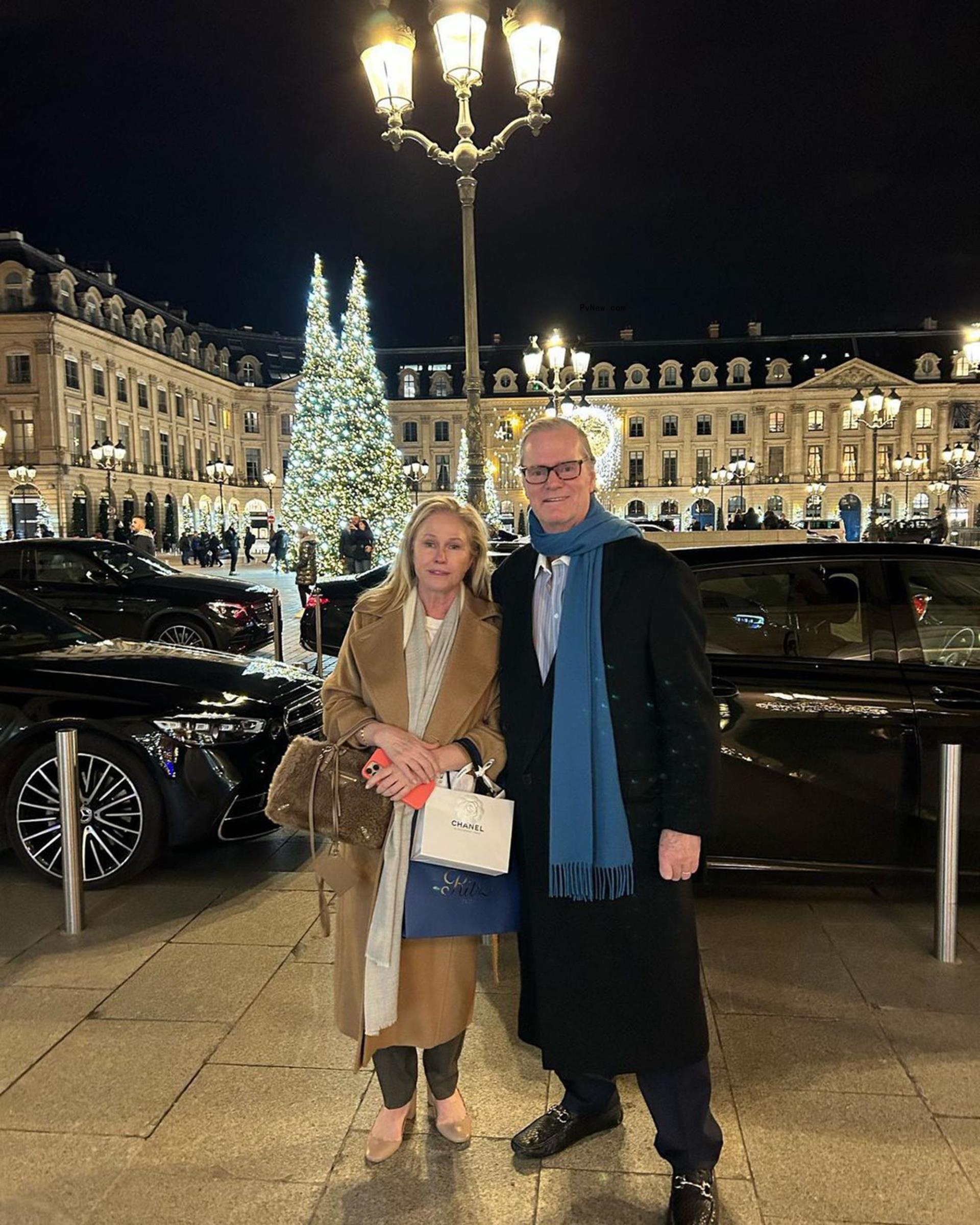 Kathy and Rick Hilton posing outside for a photo.