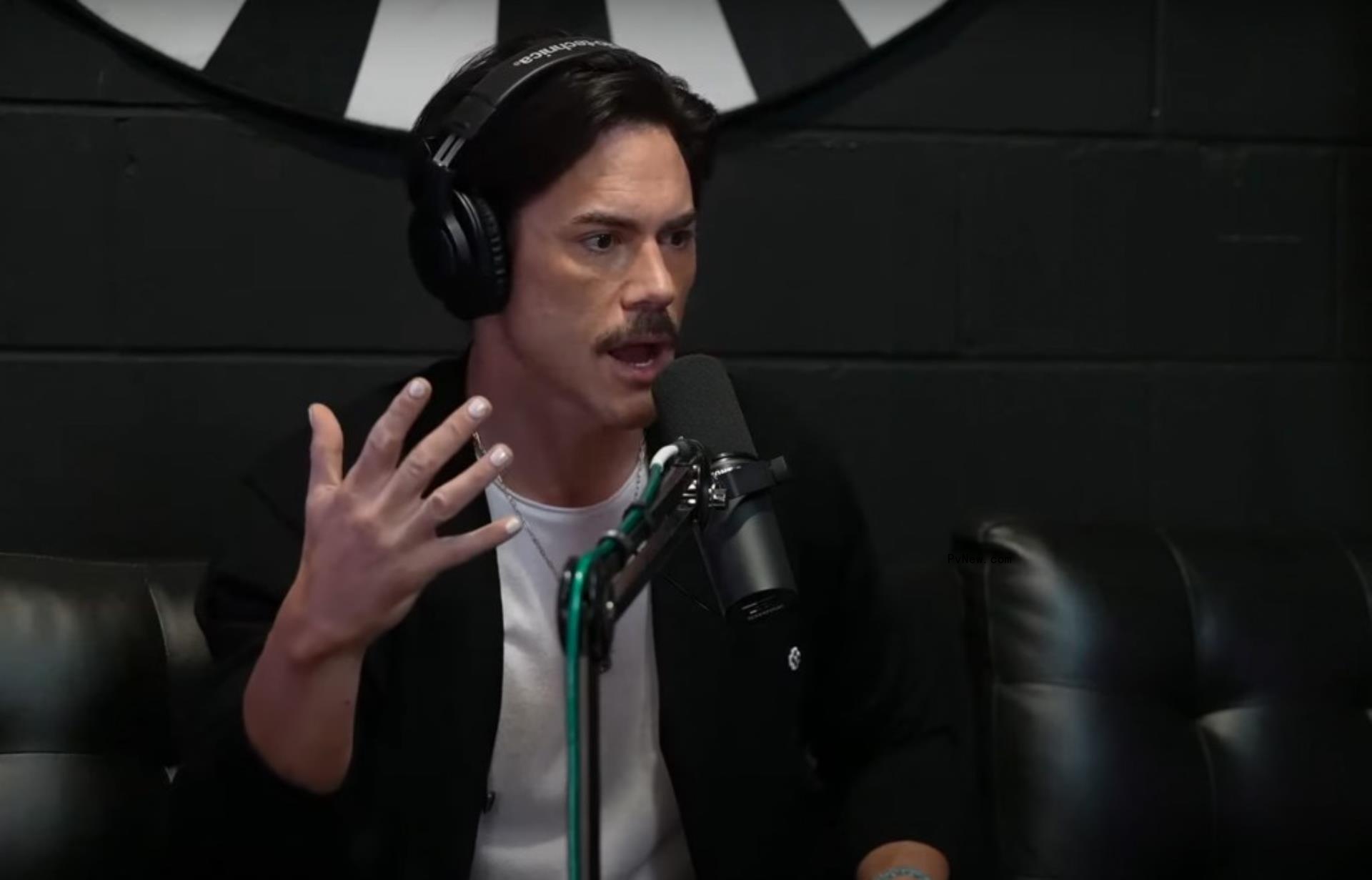 tom sandoval talking into a mic with his hand raised in a frustrated manner