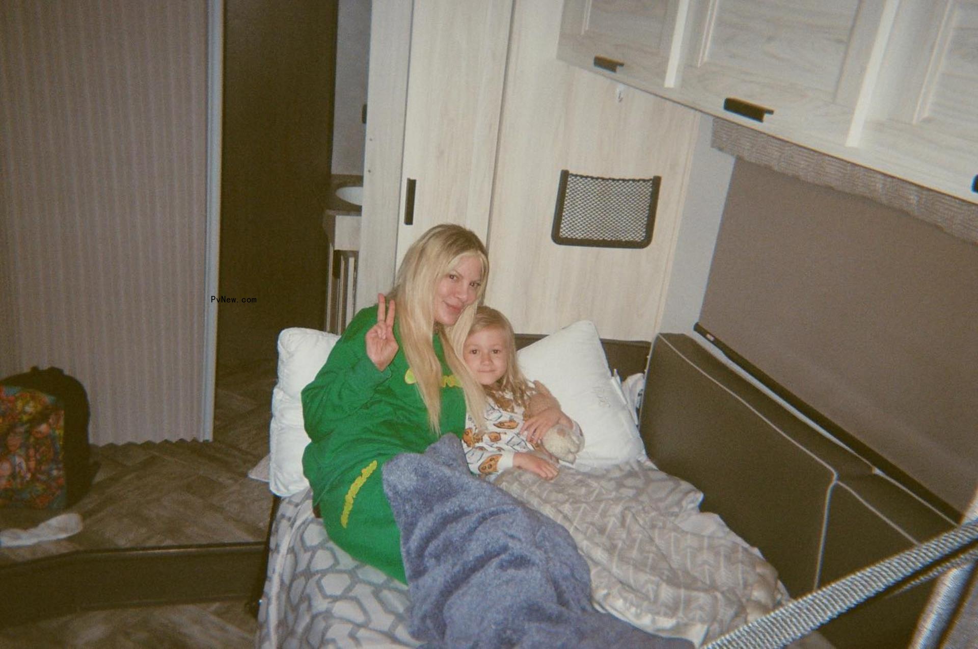 Tori Spelling in an RV with one of her five children