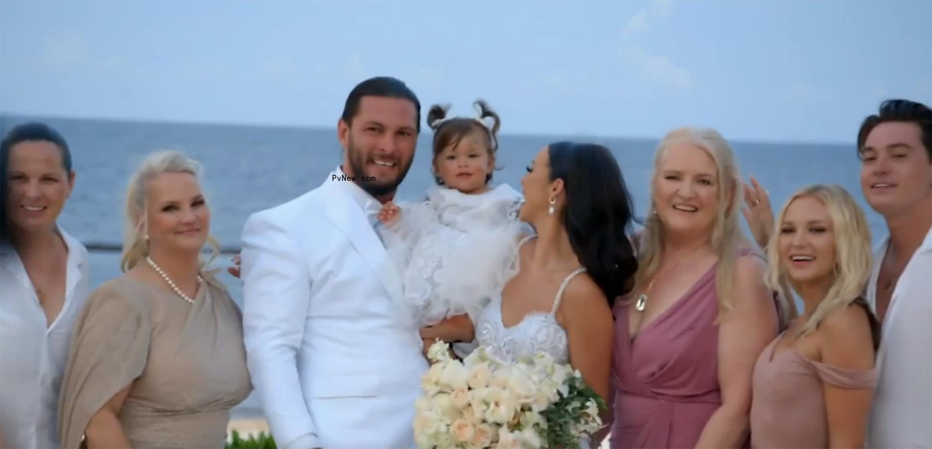 Scheana Shay and Brock Davies posing with their family at their wedding