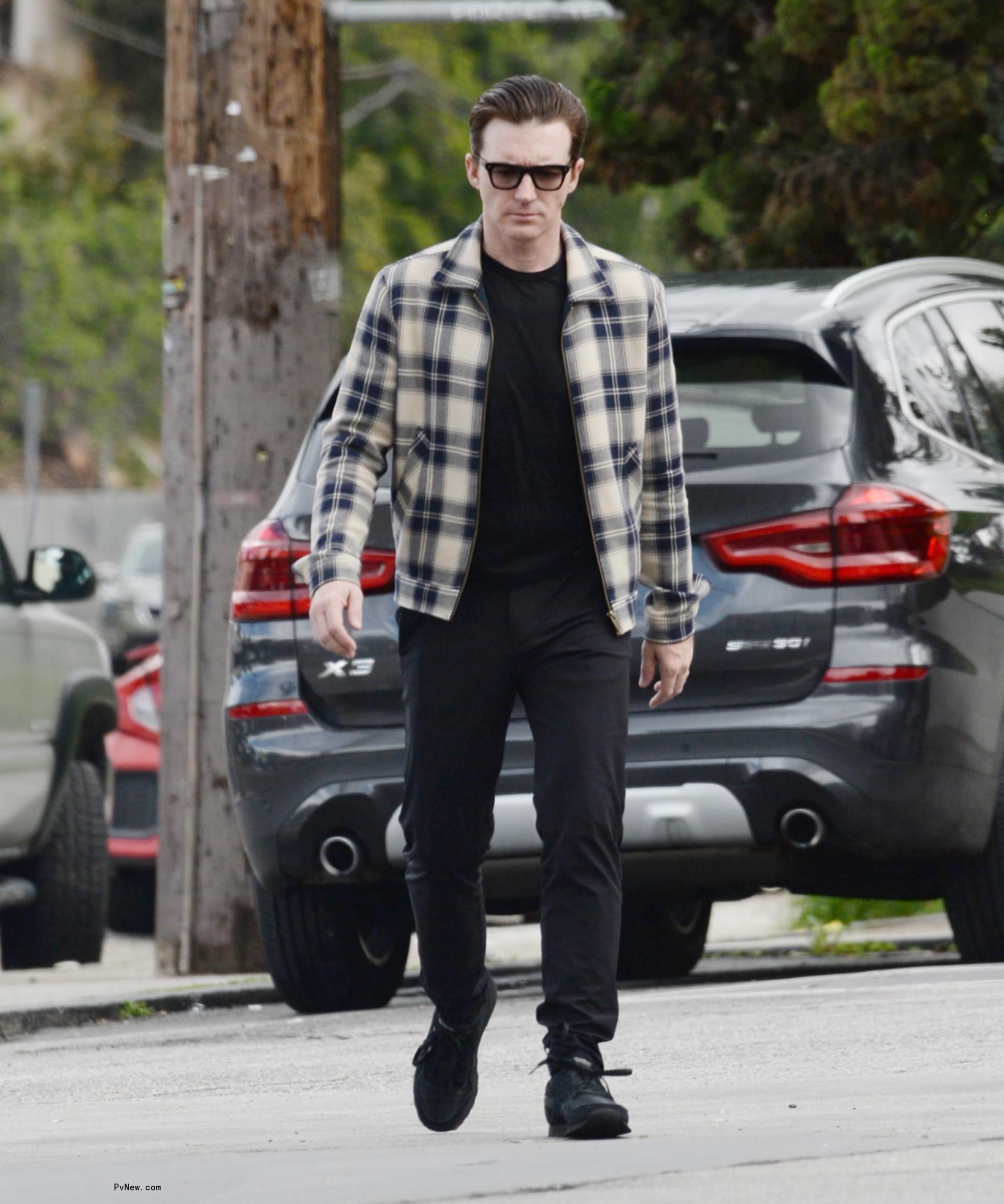 Drake Bell walking.