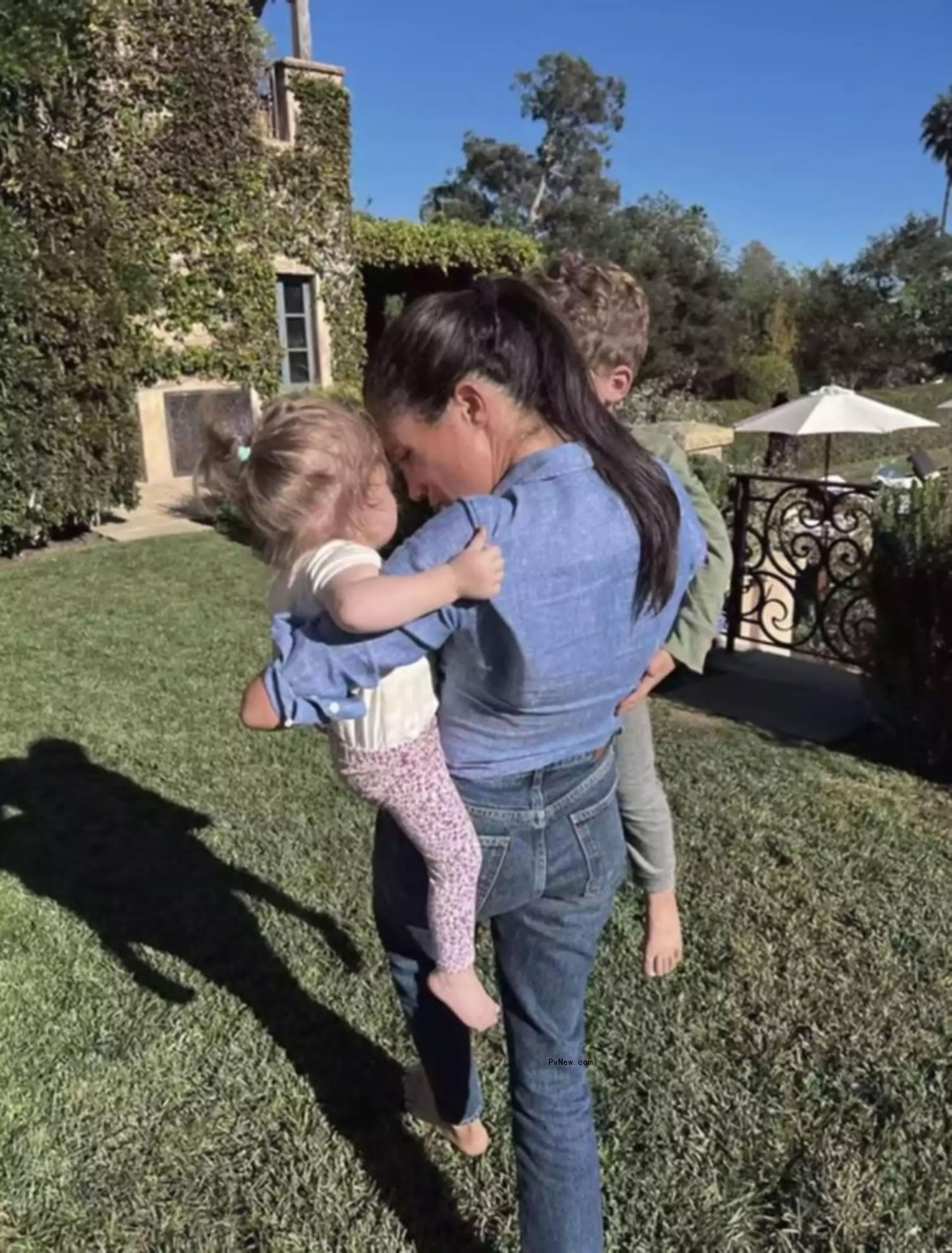 Meghan Markle with Prince Archie and Princess Lilibet.
