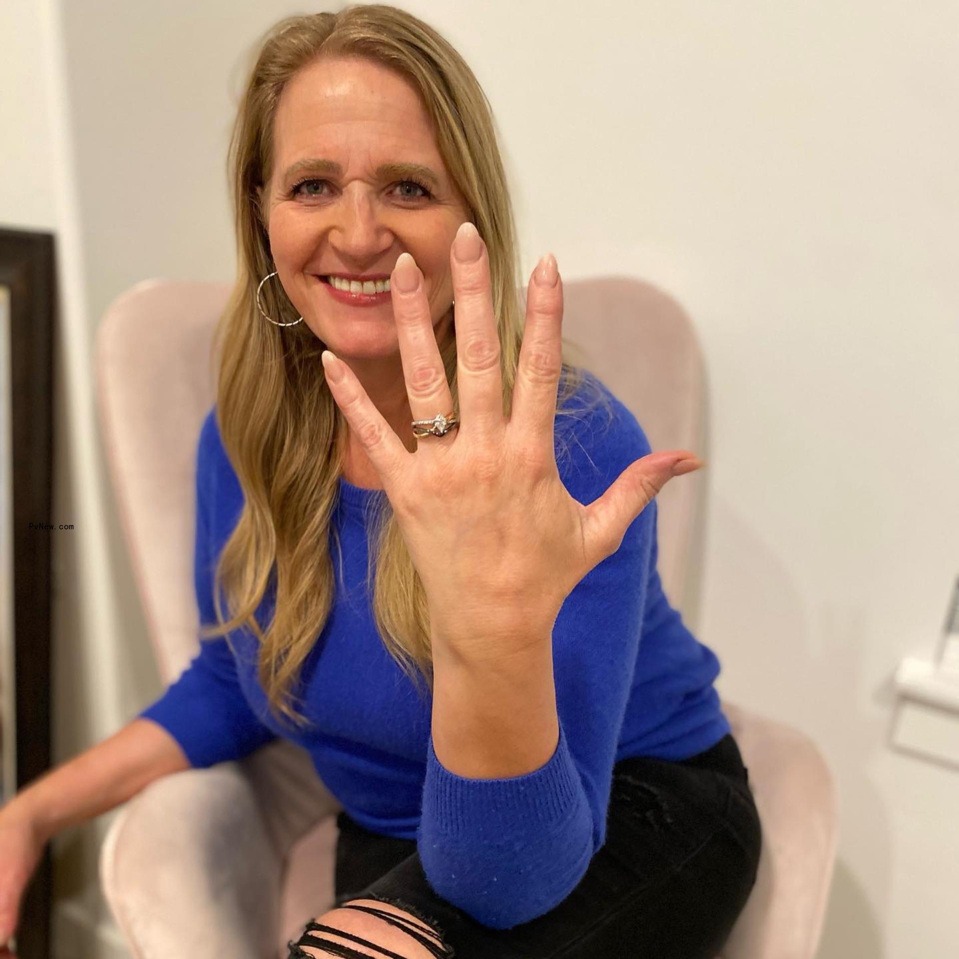 Christine Brown shows engagement ring