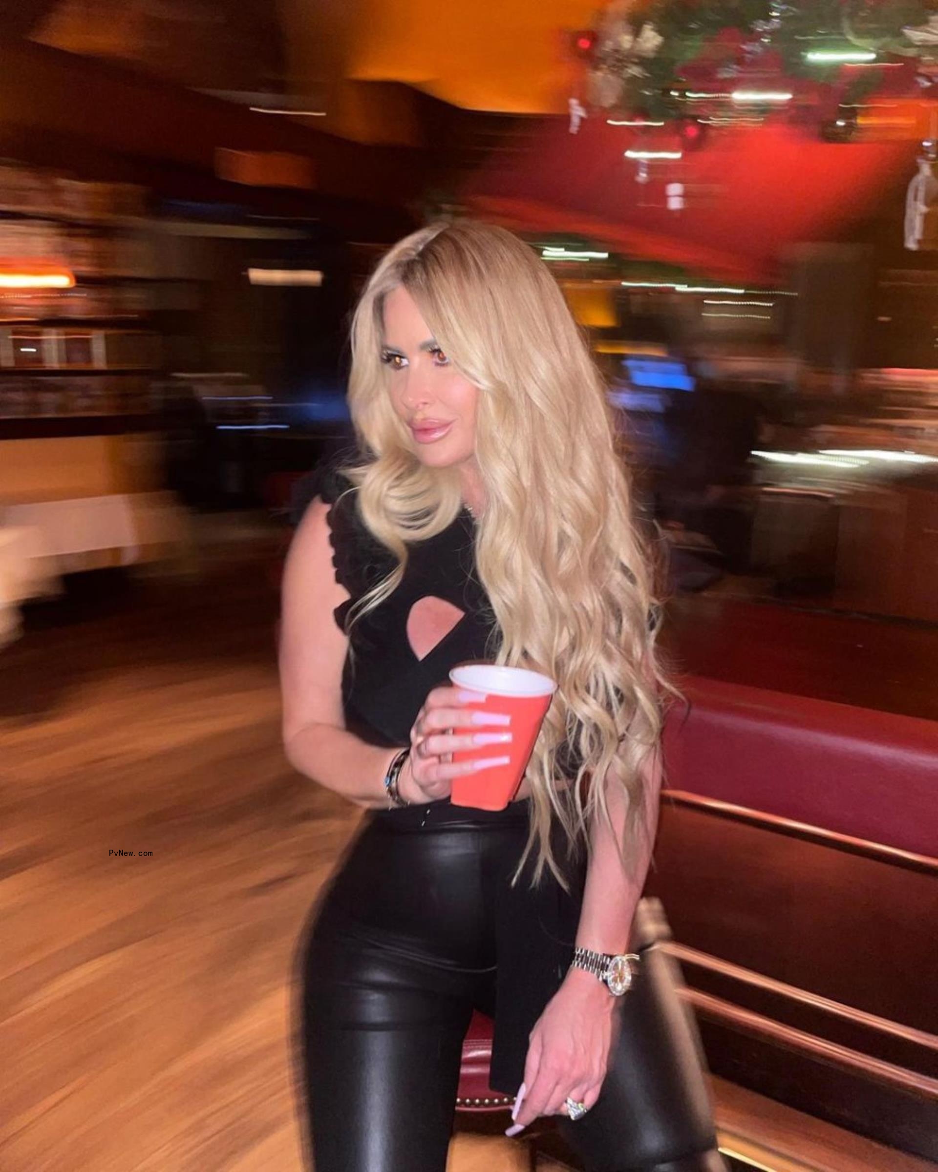 kim zolciak holding a solo cup