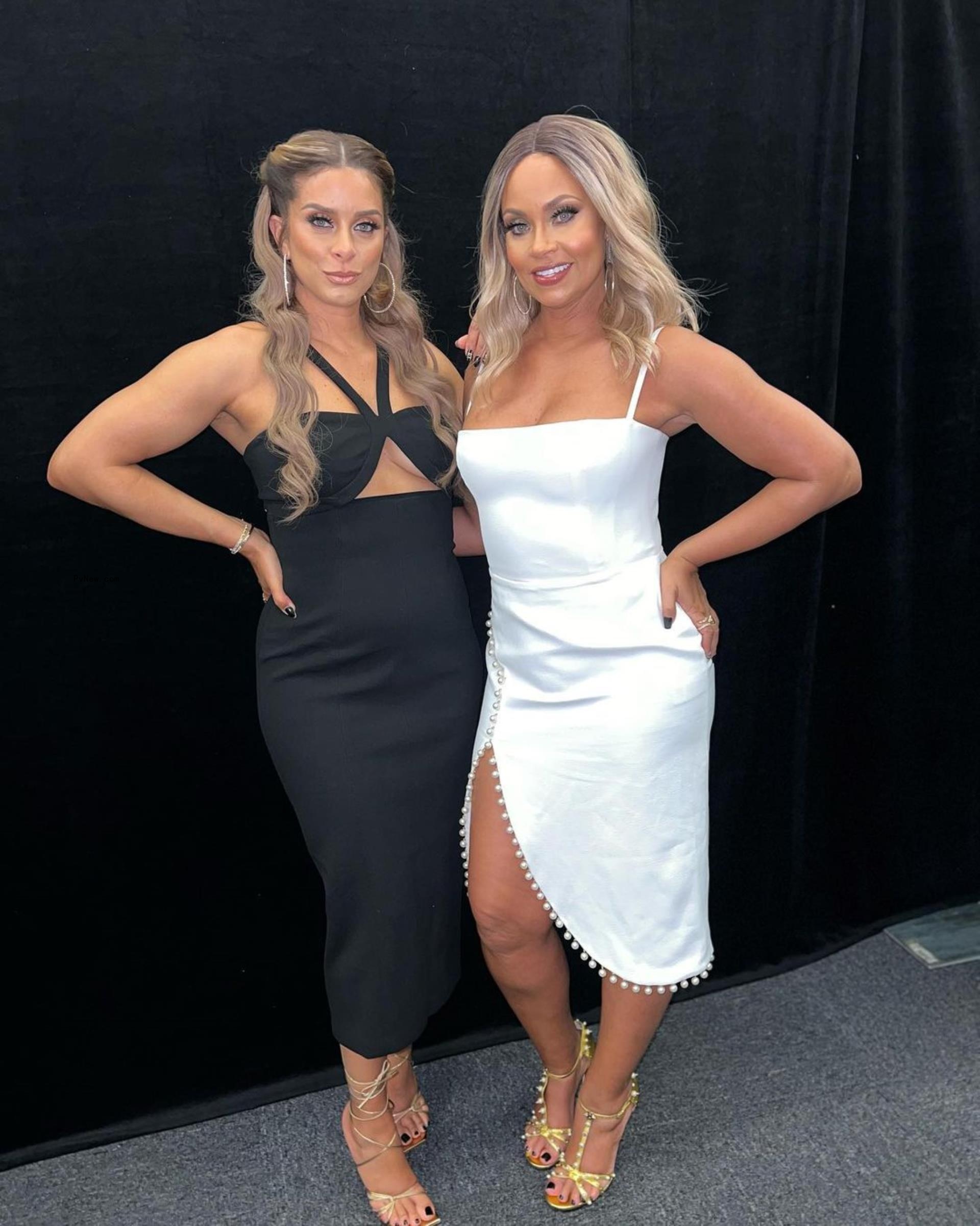 Robyn Dixon and Gizelle Bryant smile in dresses